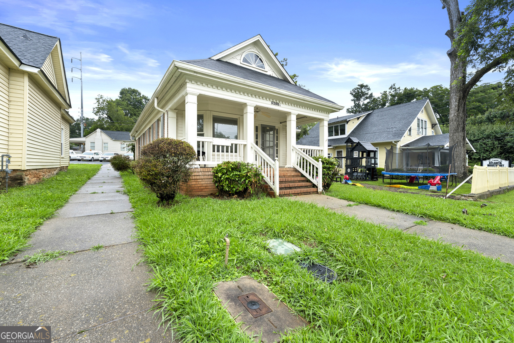Standalone office building with efficient floor plan in downtown Stone Mountain. The space includes a reception area, two private offices, a conference room (or third office), break room, and one restroom. Front porch entry, street visibility, and walkable location. Reception area with built-in counter | 2 private offices | Conference room / third office | Break room | 1 restroom | Front porch entry | Walkable downtown Stone Mountain location