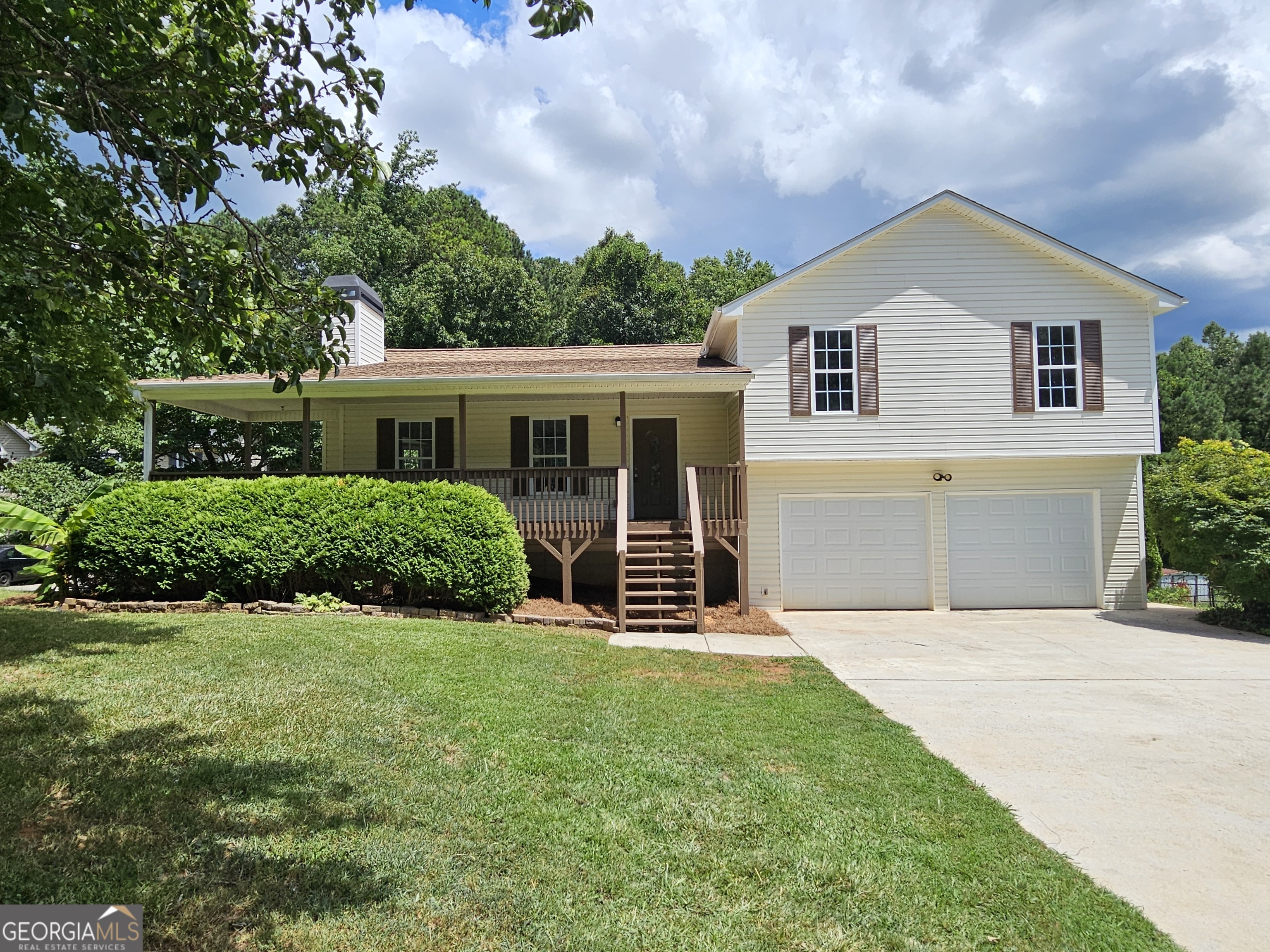 This beautifully renovated split-level home is located in a 100% USDA financing area with NO HOA-perfect for those seeking space, privacy, and convenience. Enjoy Southern charm from the expansive covered wrap-around front porch, leading into the main level featuring beautiful LVP flooring and a vaulted family room with a cozy fireplace. The fully renovated kitchen boasts new cabinets, granite countertops, stainless steel appliances, and a bright dining area with a bay window. Upstairs offers 3 bedrooms and 2 full baths, including a primary suite with a trey ceiling, walk-in closet, and updated en-suite with dual sinks with granite top, a soaking tub, and separate shower. Just a few steps below the garage level with door openers, you'll find a huge bonus room-ideal as a 4th bedroom, media room, or home office. Outside features a fenced backyard, great back deck, and easy access to the covered front porch. New updates include flooring, fixtures, appliances, HVAC, water heater, interior/exterior paint, and more. Conveniently located near Villa Rica, Temple, and Dallas! FHA Eligible: 8/28/25