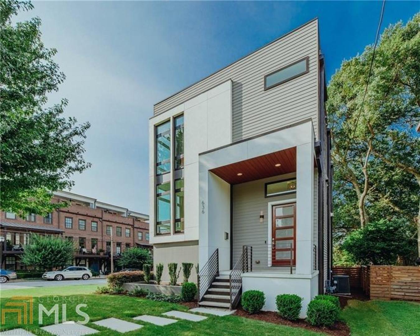 Imagine sumptuous modern design, a lushly landscaped private yard and an inviting neighborhood street scape lined with upscale modern residences. Then, imagine it within moments of the Atlanta Belt Line, Ponce City Market, and the amazing new office developments along the East Side Trail. This remarkable offering is exactly that...a private modern compound in the heart of of the "new" Old Fourth Ward...a true oasis in the city near all of the best Atlanta has to offer. Restaurants, shopping and recreation are so close by in all directions where you may not need a car most days. The high-quality contemporary build features foam insulation, insulated windows, heavyweight sliding glass doors on 3 levels, LED lighting and more. Impeccably maintained and move-in ready. Bosch induction cooking, brand-new refrigerator, custom draperies, hardwoods just refinished on all levels, epoxy-coated garage floor. Open-concept living area is superbly airy and bright, with a wall of glass that opens to reveal an expansive balcony overlooking the yard below. The spacious upstairs primary suite also features an enormous balcony which offers views to buildings on the city skyline. A spa-like bath adjoins and features a closet with extensive built-ins. An upper level loft is an ideal work-from-home space, as are either of the other two secondary bedrooms. Exceptional storage on the terrace level with two large storage areas, plus an extra large garage that can be converted to a 2-bay space. The lower bedroom also has a sliding door that leads out onto an expansive wood deck and directly to the yard...a perfect spot for guests or second home office. It's rare to find a single-family detached modern home in this area, esp. with no HOA fees. An exceptional opportunity!
