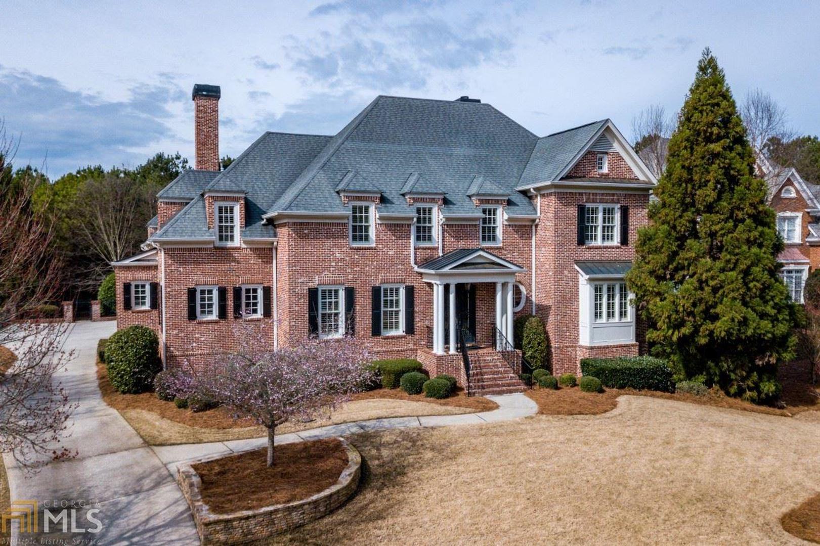 Beautiful brick home in Winfield on the River!Grand entry foyer flanked by formal dining room with butlers pantry,fireside living room with coffered ceiling.Custom chef's kitchen with oversized island,breakfast room,Viking appliances and bright keeping room with fireplace.Main level owners suite with sitting area and custom spa bath.Upper level with 3 en suite guest suites,movie theatre and loft with built in office/study.Terrace level boasts family room, gaming area, guest suite and full bath.Fireside covered porch,salt water pool with waterfall and large play yard.