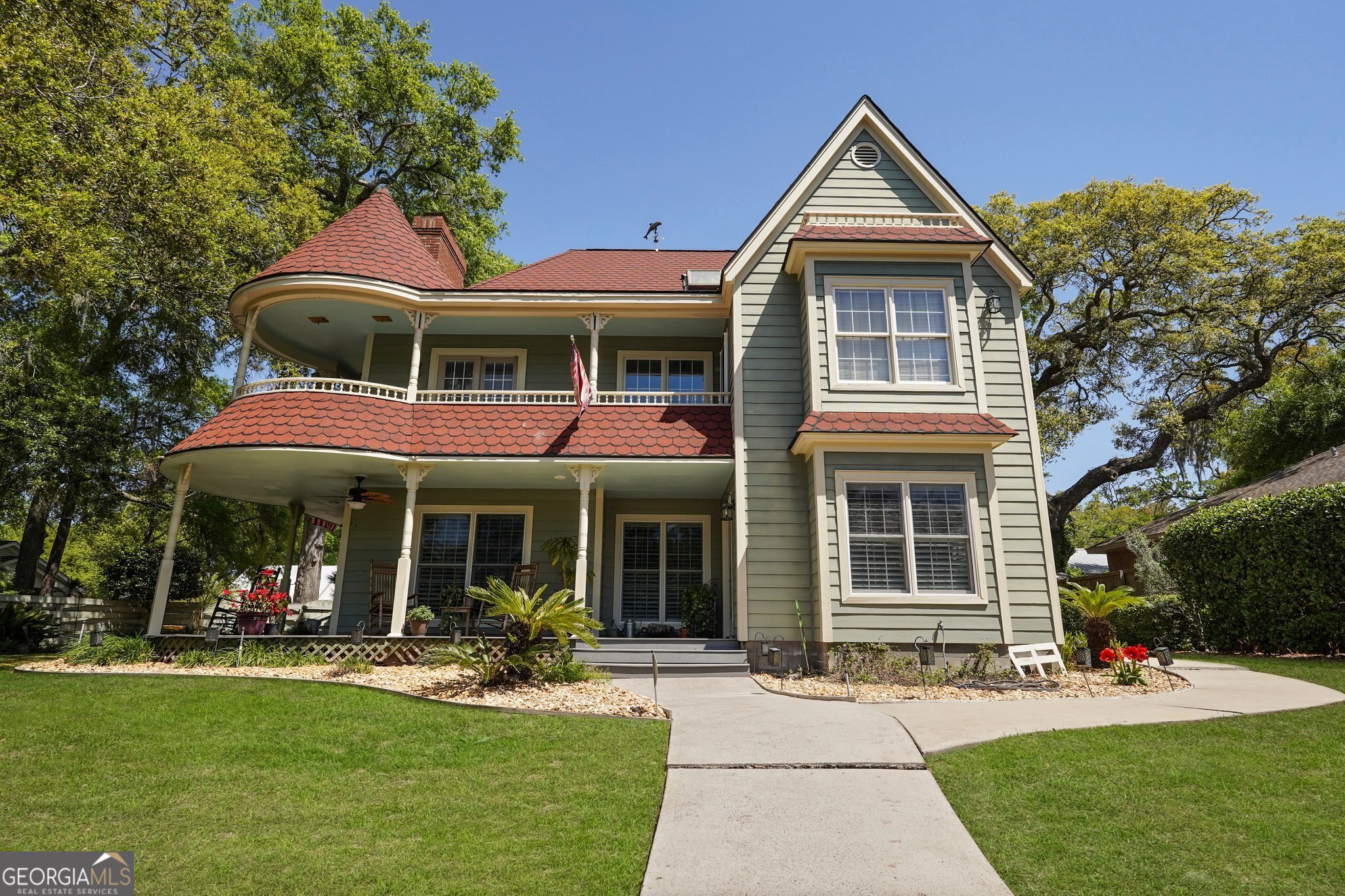 COASTAL LIVING ON A PRIVATE LAKE!!Victorian inspired with lake views throughout, walking distance to the beach and Village! Fish and kayak off your private dock! Wrap around porches upstairs and down! Many custom features including beautiful new floors, updated kitchen, newer roof, professional landscaping with irrigation system, and trex decking on porches! This quiet tropical oasis is perfect for entertaining or just relaxing and feeding the turtles! X flood zone so no insurance required! Neighborhood cut through to walk to the Village and Pickleball courts! Screen porch with hot tub!! Golf cart included!!