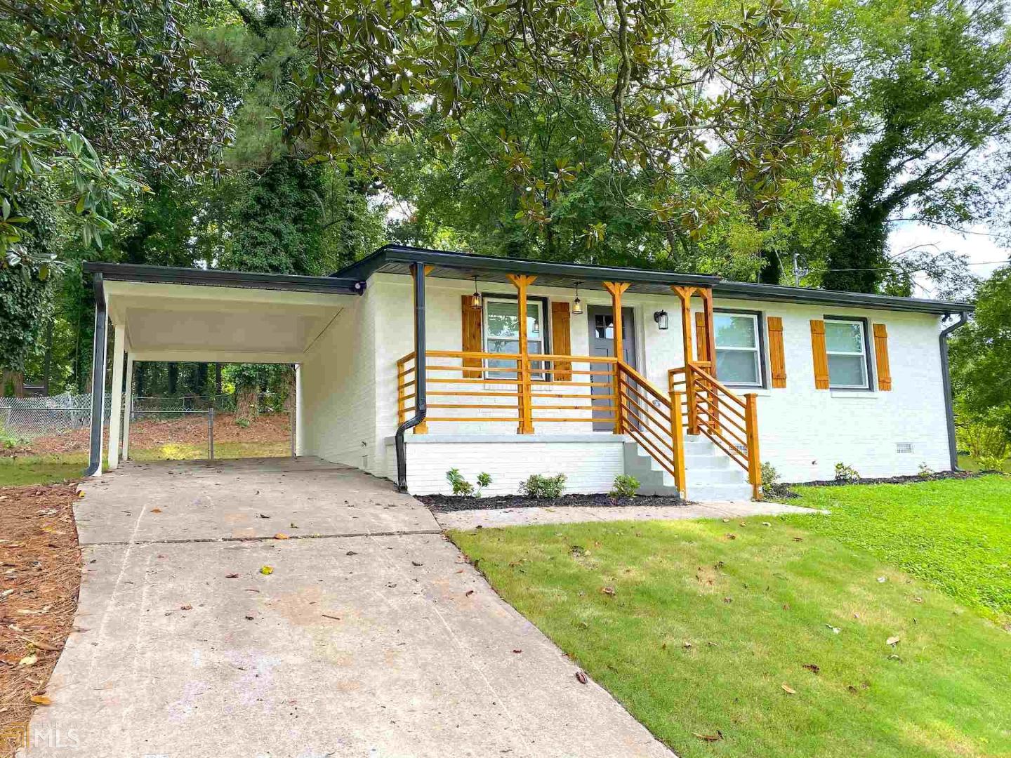 Welcome to this beautiful renovated modern farmhouse in Atlanta! This 4 sided bricked home sits king on the corner and is updated inside and out with stark white brick and cedar wooded accents. NEW electrical system & lighting, soft-close cabinetry, tile & plank flooring, granite countertops, NEW tankless water heater, NEW HVAC, and much more! You have to see it to believe it! This quaint property also has quick access to Hartsfield Jackson International Airport and minutes to the city. Schedule a showing today! Home sold AS-IS.