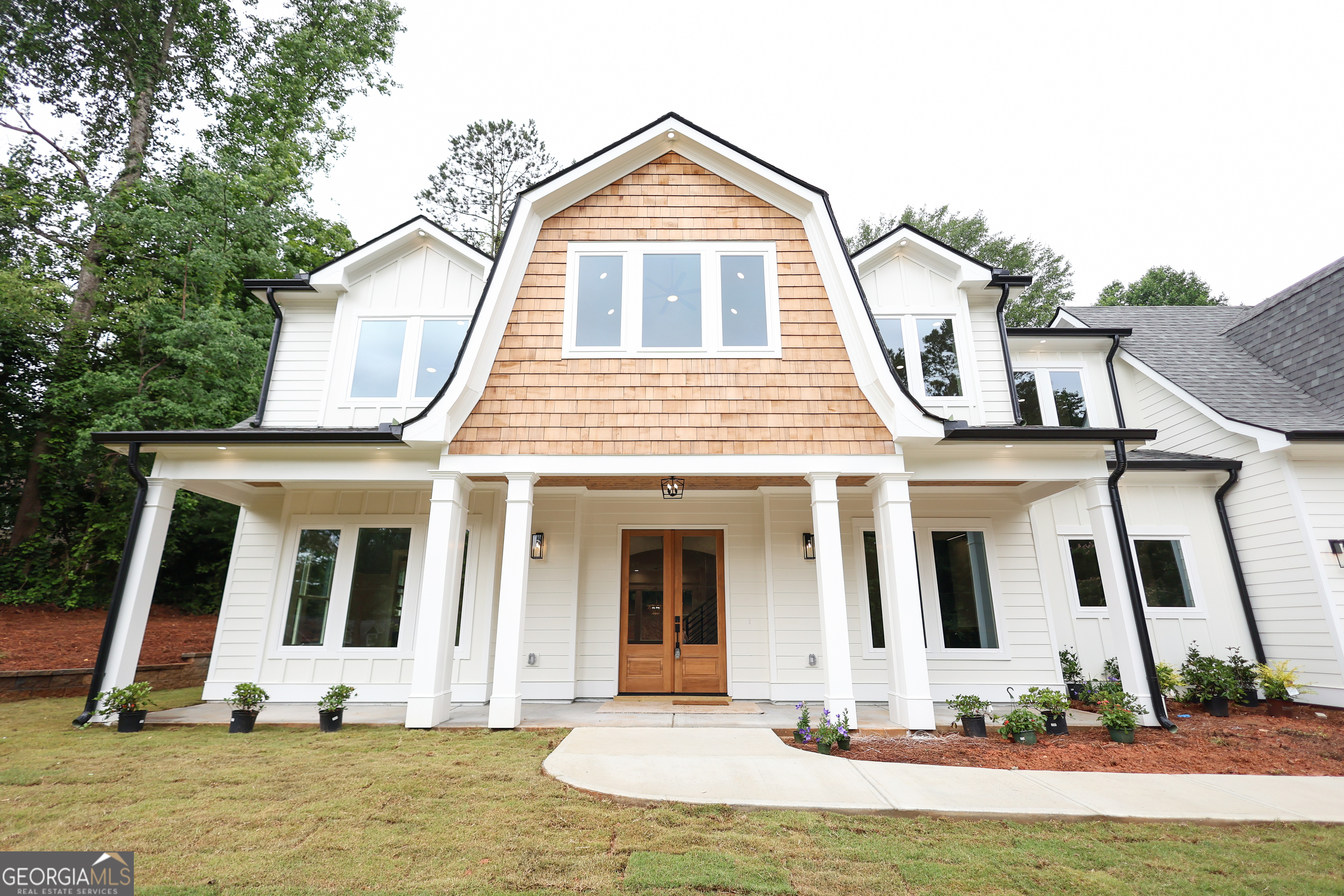 Recent price improvement! 219 Poplar is a must-see dream home with a motivated seller in the heart of Old Town Lilburn! Pictures truly don't do justice to this brand-new, 4100 sq ft, 4 bedroom, 3.5 bathroom, custom-built masterpiece offers unmatched luxury, thoughtful design and modern efficiency. Every detail has been meticulously crafted to deliver a one of a kind living experience with premium finishes throughout. Key Features: Spacious & Modern Design: This expansive 4,100 sq ft home features soaring ceilings, wide-plank hardwood floors, and a plush high-grade carpet. A generously sized bonus room provides the perfect retreat for entertainment, work or relaxation. Gourmet Kitchen: Culinary enthusiasts will love the chef inspired kitchen, complete with Thermador appliances, custom cabinetry, quartz countertops, butler's pantry with wine cooler, and abundant storage. Luxurious Primary Suite: Escape to a grand primary bedroom with two oversized walk-in closets and hookups for a stackable washer/dryer. The spa-like ensuite bath showcases a stunning wet room with a freestanding soaking tub, multiple shower heads, heated tile floor and a beautiful wood vanity. Energy Efficiency: Built for year round comfort and savigns, the home features spray foam insulation, a high-efficiency tankless water heater, and dual high-efficiency HVAC systems. Outdoor Oasis: Enjoy two inviting outdoor porch spaces, ideal for morning coffee or evening gatherings in a serene outdoor setting. Smart Functionality: The home also includes a large custom laundry room, an oversized garage, and a spacious mudroom. A dedicated home office/study with custom built-in cabinets provides a stylish workspace. Prime Location: Nestled in the charming Old Town Lilburn, this home is just a short walk to local restaurants, shops, concert venue, the greenway and Lilburn park. Discover the perfect blend of timeless craftsmanship and modern elegance in a vibrant community. Schedule your private tour today.