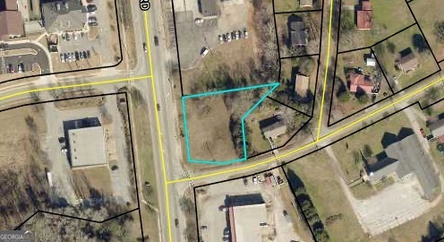 Commercial lot with 150+ feet of road frontage on Eatonton Hwy and 130 feet on Carmichael.