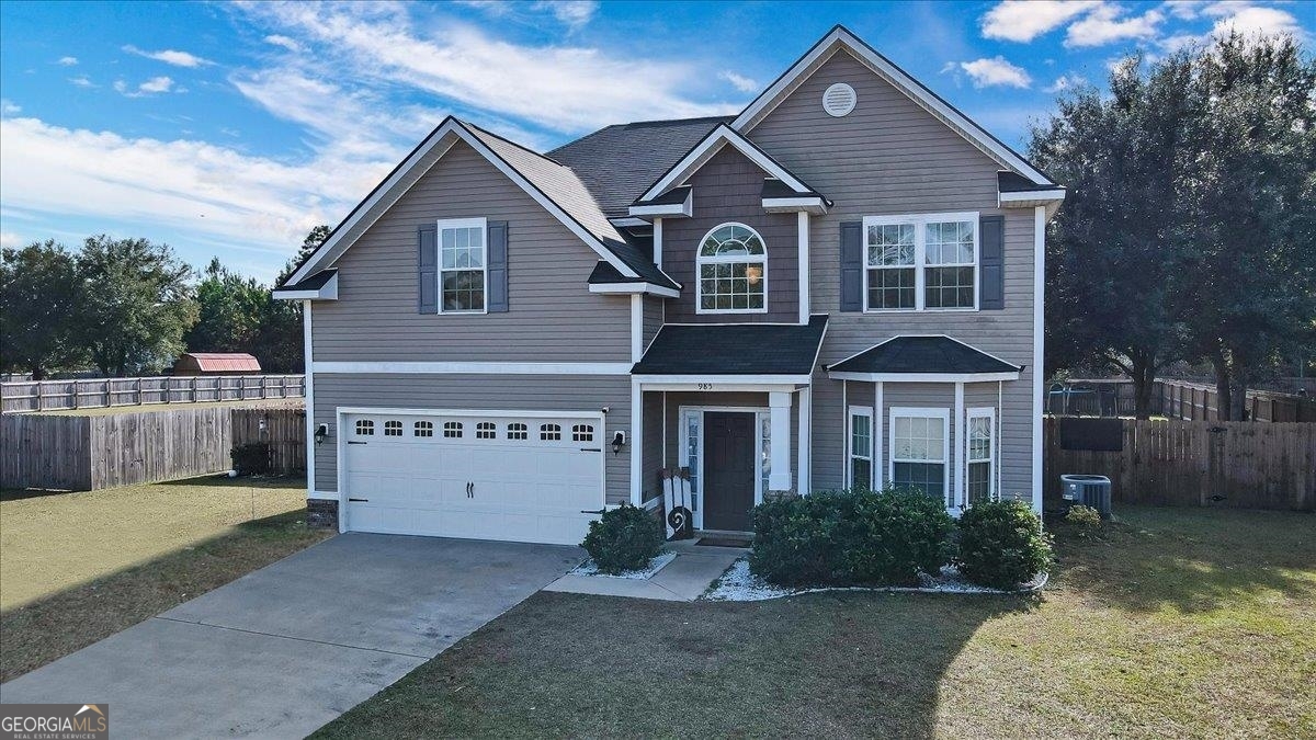Take a look at this beautiful 4 bedroom, 2.5 bath home nestled in a cul-de-sac on nearly an acre on land just minutes from Fort Stewart Gate 7. Featuring wide plank laminate wood flooring throughout downstairs, a fireplace in the Livingroom and a formal dining room. Kitchen has granite countertops a beautiful island and stainless steel appliances. All 4 bedrooms are located upstairs. The master bedroom is extremely spacious, a must see. The back yard is fenced in and there is a covered back porch.