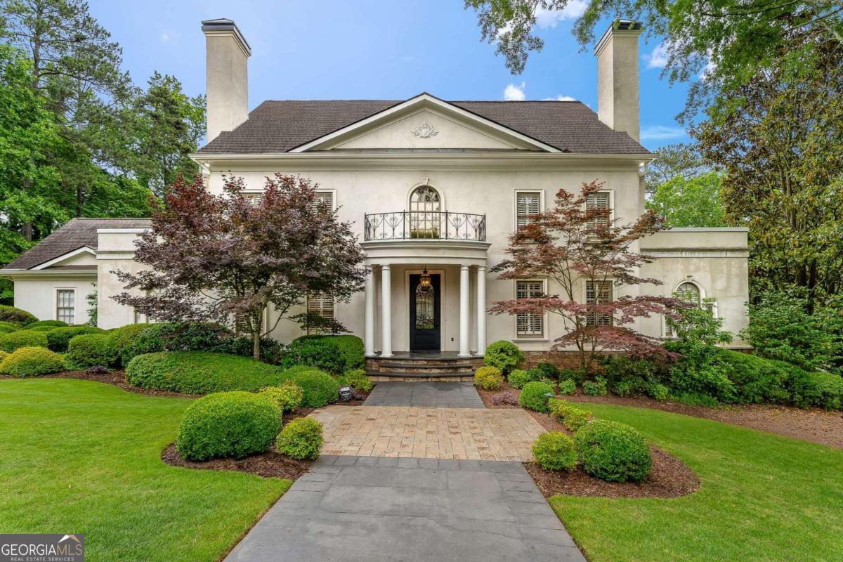 Upon entering the stylish two-story foyer, you will feel the embrace of the natural light pouring in from the floor-to-ceiling windows in the grand room. With its soaring ceiling, elegant fireplace, hardwood floors, and plenty of built-ins, the grand room exudes both sophistication and warmth. The spacious kitchen boasts a charming natural wood surround kitchen island and seamlessly connects to the kitchen dining area and grand room, in an open concept layout. A versatile office on the main floor can serve as extra entertaining space or a perfect play area for kids. The dining room features stylish textured walls, with ample space for 10-12 guests, and creates a cozy ambiance with its fireplace, your guests will not want to leave! The expansive primary bedroom on the main floor offers high ceilings, ample natural light, and another inviting fireplace, with enough room for a cozy sitting area. The sizable main floor laundry room can double as extra kitchen storage with a second fridge, and be easily transformed into a proper butler's pantry. Upstairs, you'll discover 3 bedrooms, 2 full bathrooms, and a bonus room that could be converted into another bedroom, a play area, or an office. The terrace level is fully finished with a living room, space for a bar, a movie theatre, a wine cellar, a large bedroom, a full bathroom, and an oversized room with plenty space for a fitness area with a sauna, or pool table and game room. Enjoy the sounds of birds and waterfall on the two-level steel-enforced stone back decks, totaling nearly 1,000 square feet. The sellers have meticulously maintained this home, updating the exterior with hard coat stucco. The neighboring home across the street, catty corner left of this property, underwent a complete renovation and recently sold for $2.9 million. Conveniently situated on a quiet cul-de-sac, just a 3-minute drive to Holy Innocents, 5 minutes to Heards Ferry Elementary, and 9 minutes to Chastain Park.