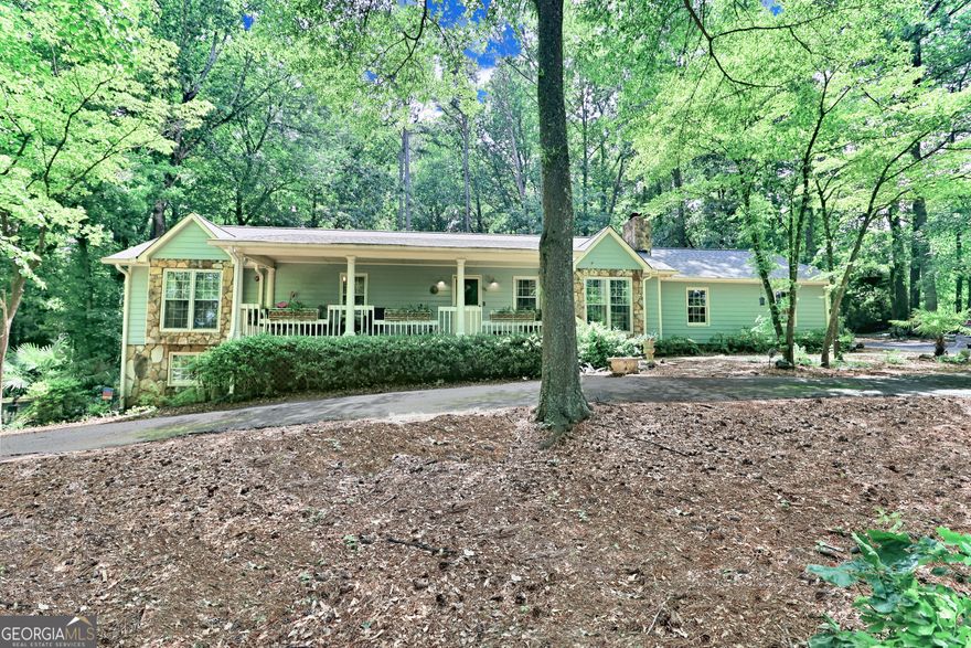 Opportunities like this rarely come along - a beautifully updated, spacious ranch with a fully finished daylight basement, nestled on a private one-acre lot in the heart of East Cobb. Perfectly located just minutes from top-rated schools, shopping, dining, and major highways, this home offers the ideal blend of comfort, flexibility, and convenience. Boasting 5 bedrooms and 3 full bathrooms, the bright and open floorplan is filled with natural light and features gleaming hardwood floors throughout the main level. Designed for everyday living and effortless entertaining, the layout provides multiple gathering spaces, indoors and out. Enjoy peaceful mornings and relaxing evenings on the newly added screened porch with metal roof, making it the perfect outdoor retreat - or greet guests on the inviting, covered front porch with classic Southern charm. The property also includes a 2-car garage with new doors, a circular driveway for added parking and convenience, a full-length attic with custom shelving for exceptional storage, and a versitile outbuilding ideal for a workshop, studio, or she-shed. The full, finished basement is sure to impress, adding two bedrooms, a full bath, a large bonus/living room, an office or media room, a kitchenette with a second laundry connection, and a private entrance with its own driveway - perfect for multigenerational living, or income potential. Located in an award-winning Cobb County school district, this home checks every box for space, function, and lifestyle. Don't miss your chance to own a truly special property in one of East Cobb's most desirable areas-schedule your showing today!