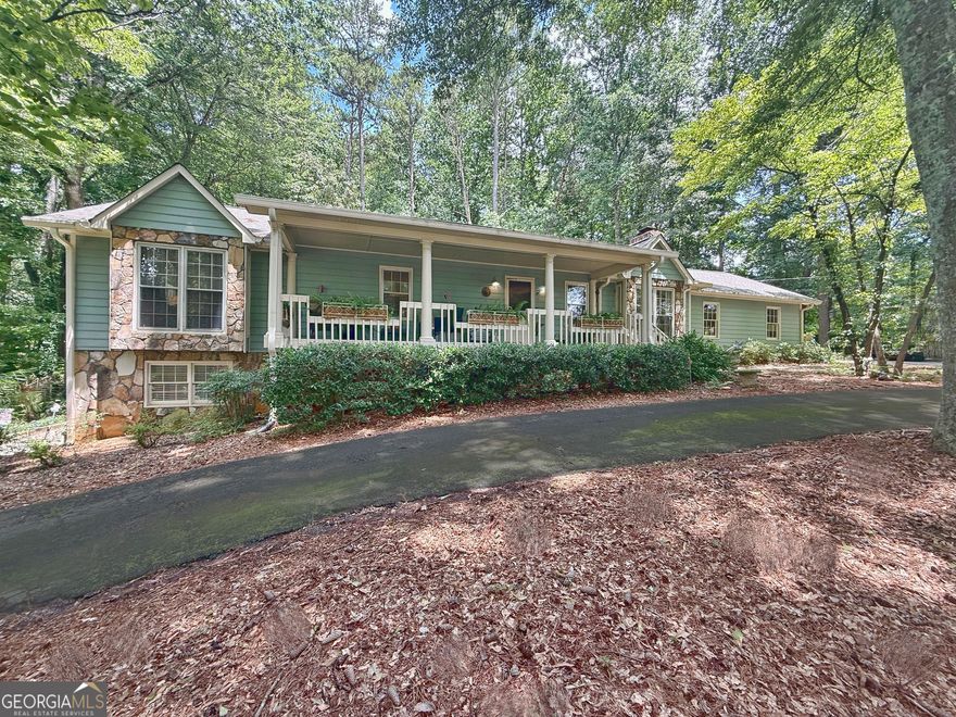 Opportunities like this rarely come along - a beautifully updated, spacious ranch with a fully finished daylight basement, nestled on a private one-acre lot in the heart of East Cobb. Perfectly located just minutes from top-rated schools, shopping, dining, and major highways, this home offers the ideal blend of comfort, flexibility, and convenience. Boasting 5 bedrooms and 3 full bathrooms, the bright and open floorplan is filled with natural light and features gleaming hardwood floors throughout the main level. Designed for everyday living and effortless entertaining, the layout provides multiple gathering spaces, indoors and out. Enjoy peaceful mornings and relaxing evenings on the newly added screened porch with metal roof, making it the perfect outdoor retreat - or greet guests on the inviting, covered front porch with classic Southern charm. The property also includes a 2-car garage with new doors, a circular driveway for added parking and convenience, a full-length attic with custom shelving for exceptional storage, and a versitile outbuilding ideal for a workshop, studio, or she-shed. The full, finished basement is sure to impress, adding two bedrooms, a full bath, a large bonus/living room, an office or media room, a kitchenette with a second laundry connection, and a private entrance with its own driveway - perfect for multigenerational living, or income potential. Located in an award-winning Cobb County school district, this home checks every box for space, function, and lifestyle. Don't miss your chance to own a truly special property in one of East Cobb's most desirable areas-schedule your showing today!