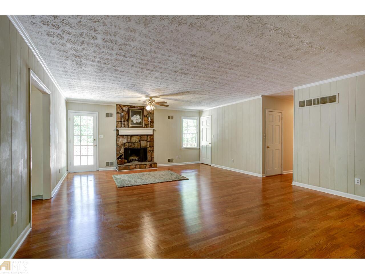 As you stroll down the lovely, one-road community of Plymouth Lane, it's hard to imagine you're still only minutes away from shopping & restaurants. Nestled directly off E. Piedmont Rd is a hidden oasis of beautiful, serene wooded lots on very mild, gently rolling hills and curves. This home has two large, stacked entertaining decks which overlook a very private & peaceful back yard. Full, finished bsmt w/a separate office & family/game room. One of the larger homes on Plymouth Lane. Owner still in process of making some renovatons. No HOA dues!!