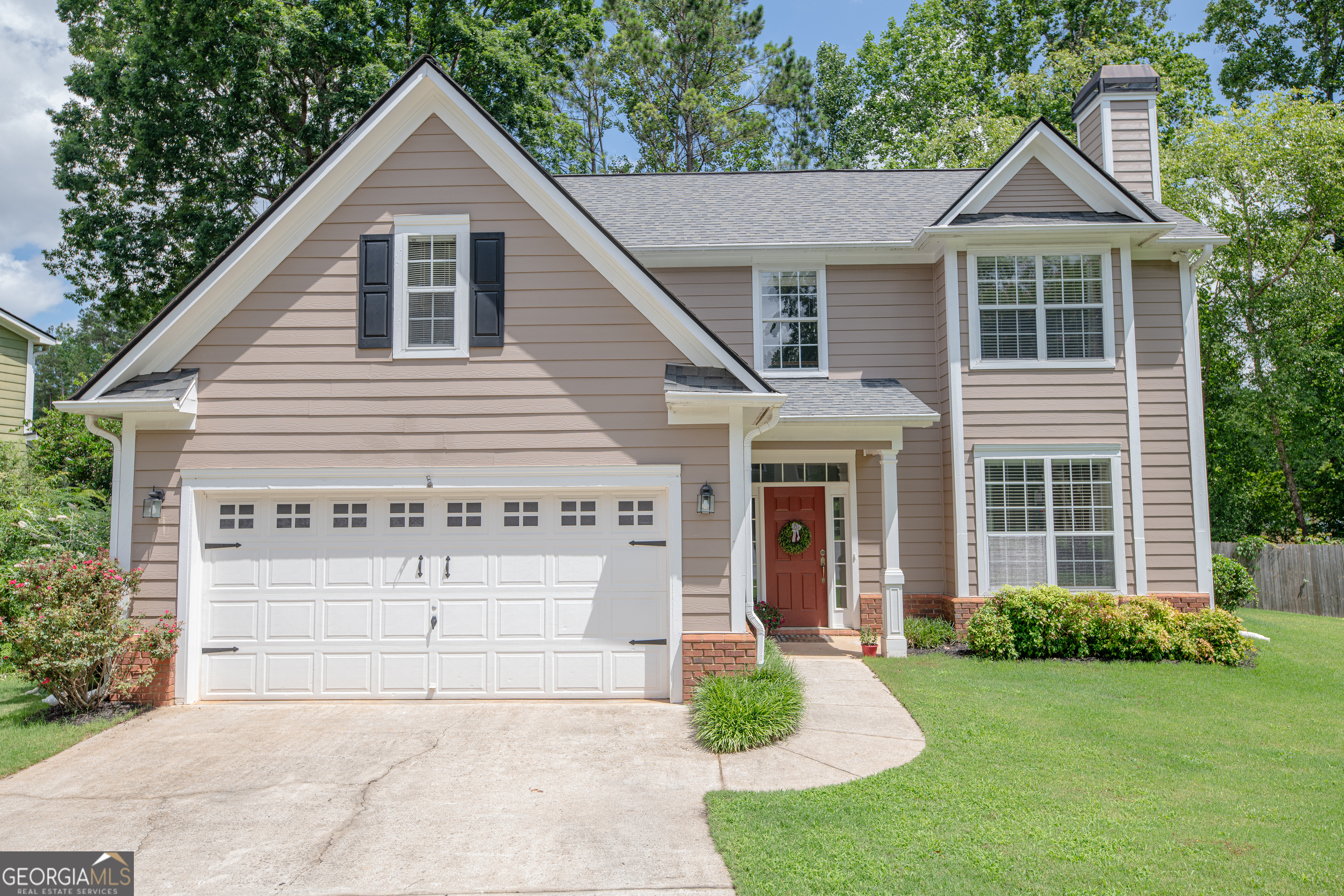Welcome to a charming, thoughtfully updated home tucked away on a quiet cul-de-sac lot in the heart of East Cobb. This 3-bedroom, 2.5-bathroom home is an entertainer's dream filled with natural light, perfect for modern living and entertaining. Spacious main level with hardwood floors, an open-concept living and dining area. The kitchen is bright and functional, featuring 18" travertine tile flooring, stainless steel appliances, tile backsplash, white cabinetry, and a sleek stainless sink. Enjoy year-round relaxation in the huge sunroom with a cozy fireplace, offering a seamless view of the private, fenced backyard-perfect for morning coffee or evening unwinding. Step outside to a covered deck, ideal for hosting gatherings or enjoying peaceful afternoons. Upstairs, you will find the spacious primary suite features vaulted ceilings, a walk-in closet, and a private owner's suite bath, while two additional bedrooms and an updated hall bath provide comfort for family or guests. Located in a kid-friendly, quiet neighborhood, this home is just minutes from Mountain View Aquatic Center, Mt. View Middle School, parks, libraries, and local favorites like Publix, Kroger, Home Depot, and a variety of restaurants. This home offers the ideal combination of privacy, location, and livability. This is a wonderful opportunity to own a move-in-ready East Cobb neighborhood in a top-rated school district. Schedule your private showing today!