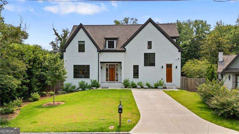 Rarely does an opportunity like this come along, a stunning 2022-built residence perfectly nestled in one of Buckhead's most coveted hidden-gem neighborhoods. Thoughtfully designed with a keen eye for detail, this home effortlessly combines modern elegance, functional luxury, and an unbeatable location. At the heart of the home, the gourmet kitchen impresses with premium Thermador appliances, including a built-in coffee machine and a stunning island with breakfast bar, perfectly combining elegance and everyday ease for both casual meals and effortless entertaining. A butler's pantry and spacious walk-in pantry provide abundant storage and enhance the kitchen's exceptional design and practicality. The space flows seamlessly into a sun-drenched living room, where expansive windows flood the main level with natural light. A beautiful fireplace anchors the space, while French doors open to an oversized back deck, creating a perfect connection between indoor and outdoor living. Throughout the main floor, opaque sun shades provide an ideal balance of natural light and privacy, enhancing the home's refined atmosphere. A formal dining room sets the stage for dinner parties and gatherings, while the thoughtfully designed mudroom and micro office bring everyday convenience to the forefront. Completing the main level, a private bedroom and a full bath offer a stylish and practical space for guests or in-laws. Upstairs, the primary suite is a serene escape, offering custom artisan-designed closets, blackout shades, and a spa-inspired bathroom with dual shower heads, perfect for personalized comfort. Two additional bedrooms share a well-appointed Jack and Jill bathroom with a double vanity, providing ample space for family or guests. The conveniently located upstairs laundry room features custom artisan storage solutions, blending everyday practicality with elevated design. Step outside to the expansive, flat backyard, a rare luxury in Buckhead, offering endless opportunities for outdoor living, dining, and recreation. Additional upgrades include wiring for built-in speakers, delivering a premium, immersive audio experience that elevates both entertaining and relaxation. This exceptional residence is just .25 miles from Peachtree Battle Shopping Center (Publix, Ace Hardware, Walgreens, and dining), less than 1 mile from Piedmont Hospital, and offers seamless access to GA-400 and I-75/85.