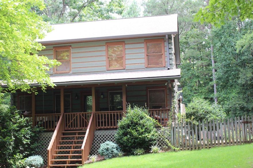 Why go on vacation to the mountains when you could own this private retreat??  This home is situated on over 2 acres with a pool, hot tub, gazebo, tons of decking, front porch with swinging bed, back porch with a view of the lush landscaping that surrounds this home with privacy!!  A new roof was installed 2018, New HVAC with ductwork 2021, and granite countertops were installed with new stove, dishwasher and refrigerator!  This home offers privacy and seclusion with easy access to shopping, restaurants, and highways!  Relax on the porch and watch the deer play!!