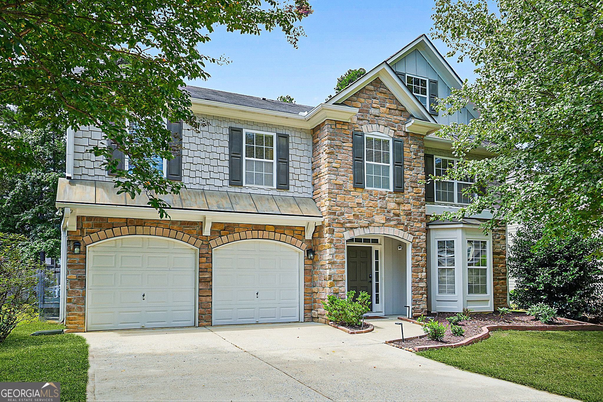 Welcome to this vibrant 2-story residence nestled in the quaint Stilesboro Ridge community. This spacious home spans over 3,000 sq ft of living space where you will find on the main level a formal living room, family room, kitchen w/ eat-in area, and a separate dining room. Upstairs you will find a versatile loft area ideal for a media room or play zone, as well as all 4 bedrooms. The Master Suite is expansive and includes a sitting area and an updated modern bathroom. Other updates throughout the home include LVP wood flooring on both levels, interior paint w/ focal point fireplace, and decorative wallpaper in half bath. Home is situated on a cul-de-sac street and has a fenced private backyard with a paved patio area. Prime location - only 3 miles to Downtown Kennesaw and 5 miles to Kennesaw Mountain! *PREFERRED CLOSING ATTORNEY: PACIFIC LAW GROUP*