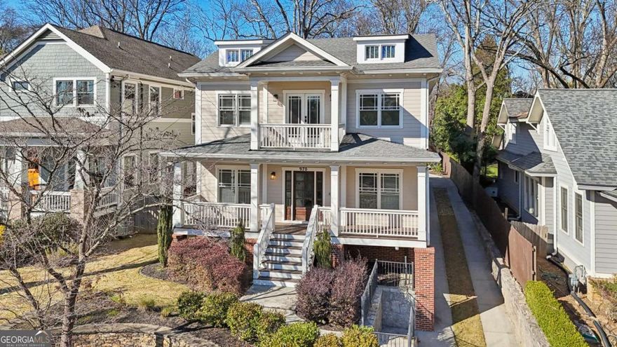 Welcome to the height of luxury living in Virginia Highlands. Classic elegance blends with modern style in this historic-style home. Designed for those who appreciate the finest in-town living, this home is situated in one of Atlanta's most desirable neighborhoods. Just a 10-minute walk to the Atlanta Beltline and a mile from Piedmont Park and Ponce City Market. This supreme location is close to top restaurants and cafes, perfect for an urban lifestyle. With five major grocery stores, including Whole Foods and Trader Joe's, just minutes away, convenience is effortless. Or if you prefer to shop farm to table, you can find all organic produce, local meats, breads, and flowers at the Morningside Farmer's Market every Saturday year-round. Living on Drewry Street you'll enjoy the famous annual festivals, like the well-known Porch Fest concert series. Virginia Highlands is truly in the heart of culture and art.   Step onto the welcoming front porch and enter the central hall. Here, classic architectural details create a unique living experience. Rich hardwood floors span all three levels, adding to the beauty and flow of this timeless home. To your right, the formal dining room boasts exquisite wainscoting and is complemented by a well-appointed butler's pantry with ample storage - an entertainer's dream. To the left, a versatile space can serve as a formal sitting room, home office, or private guest retreat, complete with an en suite full bathroom featuring luxurious marble tile flooring and shower surround.  The chef's kitchen is a statement in both style and function, featuring ceiling-height sage grey cabinetry, an oversized island with premium finishes, and a KitchenAid gas cooktop. The apron-front sink with a sleek gooseneck faucet and an expansive walk-in pantry with custom wood shelving provide both beauty and convenience. An adjacent breakfast room offers an intimate dining experience, while the elegant living room impresses with built-in bookshelves, a wood-burning fireplace with gas starter, and seamless access to the screened back porch with flagstone flooring - creating the perfect setting for refined indoor-outdoor entertaining.  Upstairs, you'll find two roomy secondary bedrooms, each with its own full bathroom and expansive closets, providing ultimate privacy and comfort. The lavish primary suite is a sanctuary of sophistication, bathed in natural light and featuring dual walk-in closets. The spa-inspired en suite bath is adorned with marble tile, an oversized shower, double vanities, and a linen closet, with seamless laundry access from both the hall and primary bath. A sunny bonus retreat space with French doors leads to the upper balcony, where panoramic views of Drewry Street and the Atlanta skyline provide a breathtaking backdrop for relaxation.  The lower level adds to the home's luxury. It features an extra bedroom or recreation space, a full bath, and an enormous amount of storage. Outside, a detached two-car garage sits just steps from the home, while the partially fenced backyard includes a dedicated storage shed.  This home seamlessly blends elegance, function, and an unrivaled location - making it a true masterpiece in Atlanta luxury living.