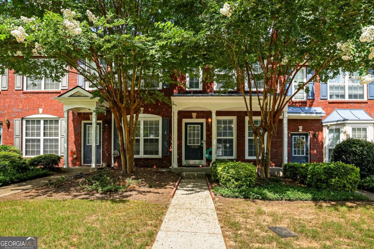 Step into comfort at 1620 Cove Creek Circle, an inviting townhome in the heart of Norcross, Georgia. This two-story gem features 2 spacious bedrooms, 2 full bathrooms upstairs, and a convenient half bath on the main level. The open floor plan is enhanced by hardwood flooring and a cozy fireplace, while the private backyard patio and charming front porch offer perfect spaces for relaxation and entertainment. Don't wait-schedule your visit today and make this delightful home yours!