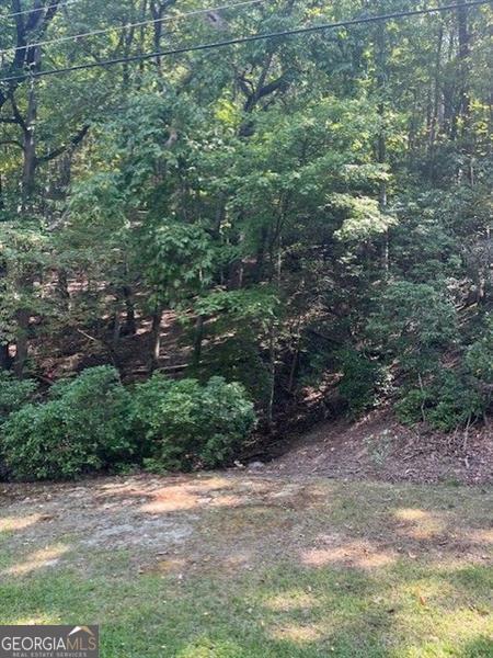 Great building Lot in Lake Arrowhead. A premier gated community offering a that amazing with swim, tennis, pickleball, Golf on 18-hole championship course, miles of hiking trails, Park, Lakes, marina, fishing and so much more. House can be built, or lot can be purchased just to have the ability to use all the great amenities.