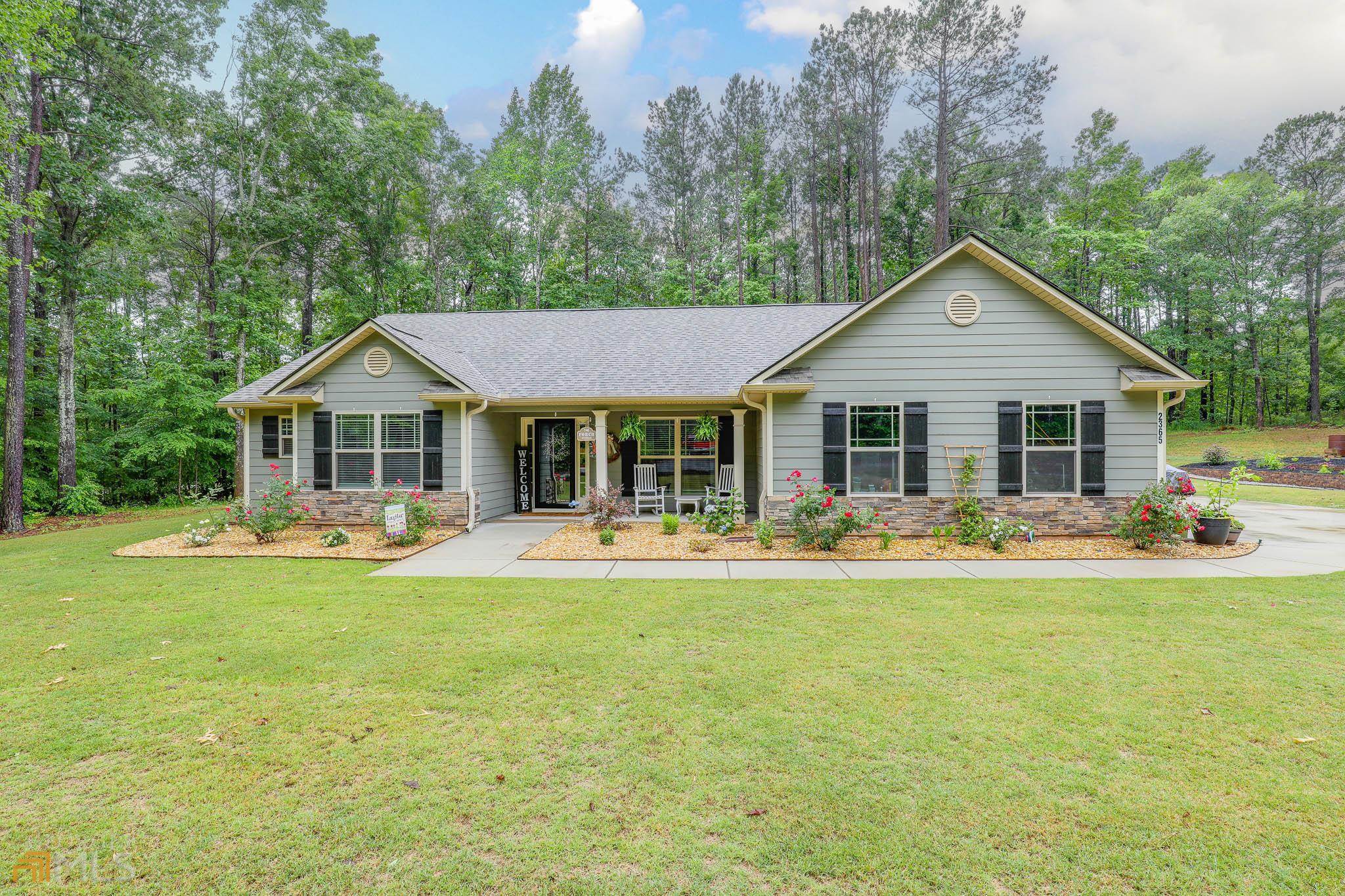 Check out this meticulously kept ranch home that sits on 2.5 acres and is located just minutes from downtown Senoia. This home is less than 2 years old with no HOA! Bring your RV and keep it travel ready, on site with 30 amp hook up located on the side of the home. This home boasts 4 bedrooms, 3 baths and has a covered patio. With raised garden boxes and garden beds added around the property, you can stop to smell the flowers, grow your own vegetables or a little bit of both . The landscaping additions are to die for. While this home is on public water, there is also a well on the property. If you are looking for your little slice of paradise, look no further.