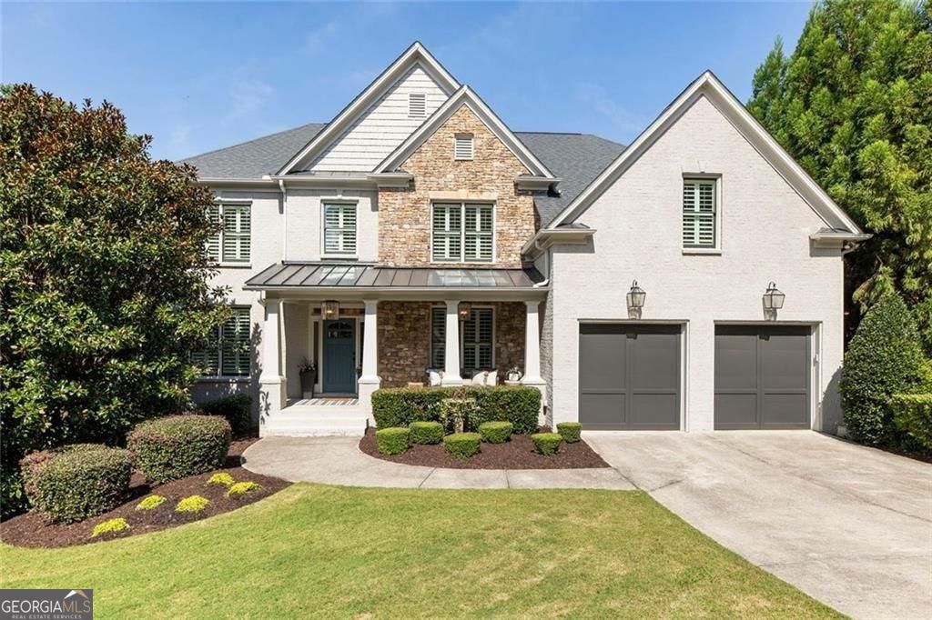 Freshly painted with new carpet, this MOVE-IN READY HOME is set within SOUGHT-AFTER WESTBROOK on a cul-de-sac lot in a park-like setting with a shared fire pit. Home includes built in speakers and SONOS sound system with room level volume controls in living room, kitchen, primary bed, primary bath and outside on the deck. The main level centers around a spacious living room with a stone fireplace, custom built-ins, coffered and beamed ceilings, and detailed trim. A private office, full guest suite with bath, and an inviting dining room with elegant light fixtures and trim details provide versatile spaces for work and gatherings. The kitchen offers stone countertops, a large island with storage, a walk-in pantry, and stylish cabinetry, while a mudroom off the kitchen adds convenience. Hardwood floors flow throughout the main level, connecting the interiors to a serene backyard framed by mature trees-perfect for entertaining or unwinding outdoors. Upstairs, the oversized primary suite includes a soaking tub, frameless glass shower, marble finishes, updated lighting and cabinet hardware as well as a large walk-in closet. Four additional bedrooms-two with private baths-are generously sized with walk-in closets. A spacious laundry room with folding counter and storage completes the upper level. The unfinished daylight terrace level (1698 sq ft) provides endless potential for future living space, including a guest suite, recreation room, or full bath. WESTBROOK is surrounded by mature hardwoods with tree-lined streets with sidewalks, this home blends warmth, functionality, and timeless design. The home is walkable, via a nature trail, to the amenities. Residents can enjoy swim, tennis, pickleball, basketball, and a vibrant community atmosphere, all minutes from Vickery, The Collection, Cumming City Center and the Greenway as well as the award-winning Forsyth County schools, one of Georgia's top-rated districts. This home is a rare opportunity to own in one of the area's premier neighborhoods, offering a combination of location, amenities, and timeless design.