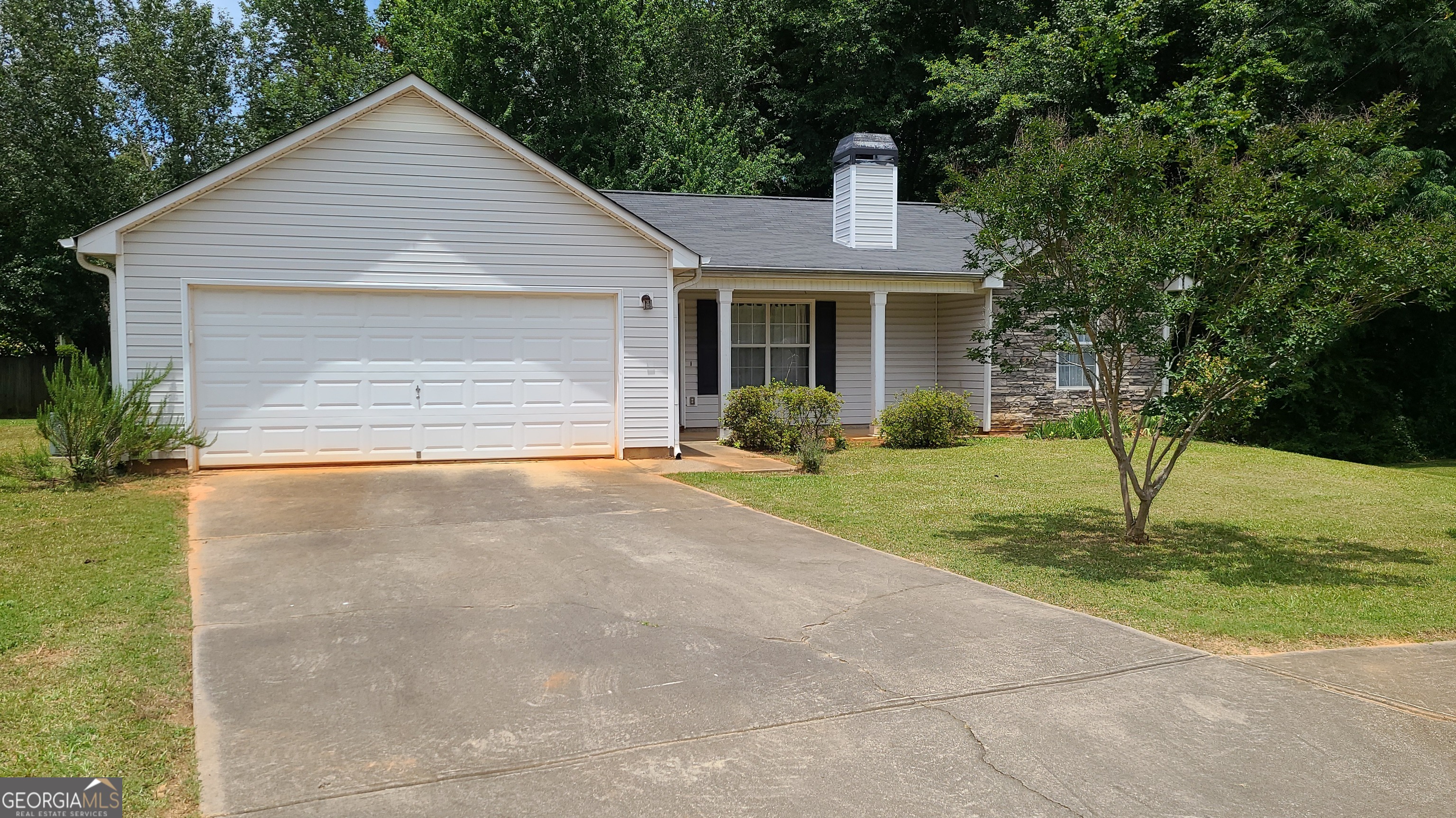 Located off Peeksville road in Locust Grove you'll discover this quaint neighborhood and this perfect 3 bedroom house. New LVP in2024 throughout. Efficient kitchen with dining area. Front porch and back patio. Peaceful setting in a cul-de-sac. Low traffic. Master bedroom has nice size walk-in closet, double vanity. 2 good sized guest bedrooms to share a hall bath. Laundry closet in hallway. 2-car garage. Low maintenance rental with landscaping provided.