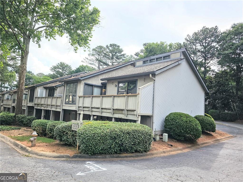 Fully renovated townhouse in a sought after location near the interstection of Lower roswell - Johnson Ferry road. This unique floor plan has vaulted ceilings on the main floor. Brand new kitchen with open access to the living area and to the outside deck. The formal dining area is next to the kitchen.There are two living rooms on this house, each floor has a living room with fireplace. Master bedroom is upstairs and it has a brand new bathroom that connects to the hallway. Downstairs area has a large living area and a bedroom with full bath with outside access. The powder room is on the lower level. The subdivision is going through a major renovation, which will see property values go up very soon. There is no seller's disclosure. This is a flip. Listing agent is a principal for the entity that owns the property and will sign on its behalf. Closing with Weissman Law firm. The seller has already covered a $25,000 special assessment -at no cost to you! This includes upcoming upgrades like: siding repair, pool repair, asphalt work and professional tree removal. As a result, property values are expected to rise, making this not just a home, but a smart investment -all the benefits, none of the cost!