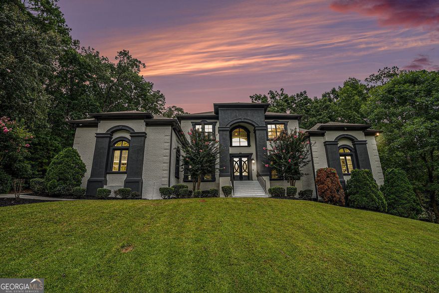 Imagine coming home to a private, gated sanctuary that feels a world away-yet keeps you connected to everything Atlanta offers. Welcome to 4025 Cascade Rd SW, a custom-built estate where 3 levels of refined living meets a lifestyle of elegance, comfort and effortless entertaining. From the moment you step inside, THIS HOME MAKES A STATEMENT. Soaring floor-to-ceiling windows flood the main level with natural light, showcasing a dramatic open-concept design meant for both quiet mornings and unforgettable evenings. The great room, anchored by a commanding stone fireplace, flows seamlessly into formal dining and a chef-inspired kitchen, CREATING A SPACE WHERE CELEBRATIONS COME ALIVE AND EVERYDAY LIVING FEELS EXTRAORDINARY. The Owner's Wing on the main level offers more than a retreat-it's A PRIVATE HAVEN WITH A COZY FIREPLACE, SPA-STYLE SHOWER, AND EXPANSIVE WALK-IN CLOSET. A secondary bedroom w/ensuite bathroom on the main level ensures guests or family enjoy privacy and comfort. Upstairs, 3 more spacious bedrooms and 2 full baths provide versatility, while THE TERRACE LEVEL TRANSFORMS THE HOME INTO AN ENTERTAINER'S DREAM-complete with a theatre room, family room with fireplace, open recreation area, bonus room with full bath, 6th bedroom and a stylish kitchenette with bar. Style it your way and finish out the spa room! Indoor and outdoor living blend seamlessly. Step onto the expansive covered deck, accessible from the kitchen and Owner's Suite, where you can sip morning coffee while listening to the breeze through the trees. Below, the covered terrace-level patio invites you TO HOST EVERYTHING FROM SUMMER COOKOUTS TO GAME-DAY WATCH PARTIES-all while overlooking your private, tree-lined 1.027-acre lot. This estate's lifestyle extends far beyond its walls. Just minutes away, explore the trails of Cascade Springs Nature Preserve, enjoy afternoons at West Cascade Park or Melvin Park, or take advantage of Atlanta's thriving dining and cultural scene in nearby Downtown and Midtown. For jet-setting professionals, Hartsfield-Jackson International Airport is within easy reach, offering seamless travel access without compromising on privacy. With 6 bedrooms, 5.5 bathrooms, 4 fireplaces and a 3-car garage, THIS RESIDENCE BALANCES SOPHISTICATION WITH WARMTH, MAKING IT EQUALLY SUITED FOR ELEGANT ENTERTAINING AND EVERYDAY LIVING. 4025 Cascade Rd SW isn't just a home-it's a story waiting to be lived.