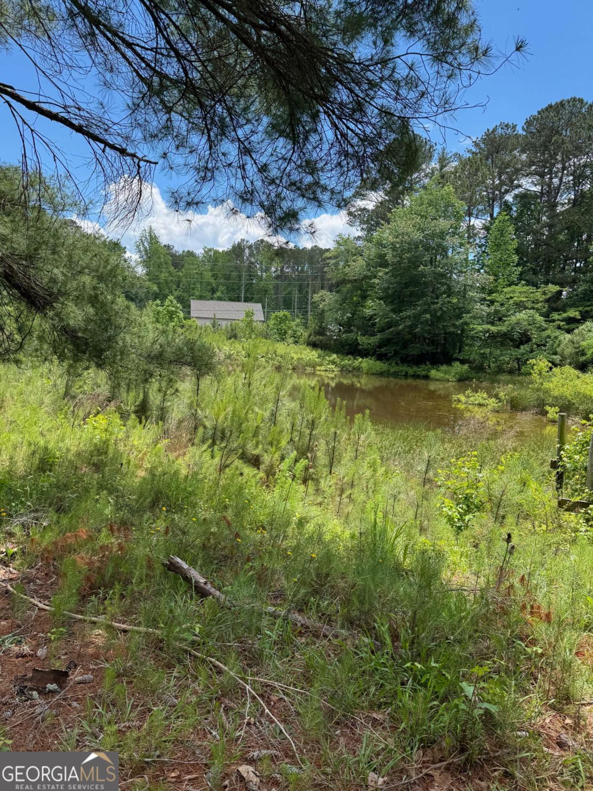 9.7 acres in the heart of west cobb... perfect for a large estate with possible multiple building sites, could be developed into 80,000 lots without sewer, or if buyer obtains sewer permit could be possibly developed into 15-16 lot R20 community with no rezoning required. Seller willing to allow time to acquire sewer easements if that is route buyer wants to take. No soils testing done, small pond at front of land is partially on this acreage, boundary survey and disclosures in documents. Call to get access to gate code will only give out code to confirmed people visiting site for consideration. Let me know if you want to walk the home, I do not currently have keys for that as the value is in the land not the home.