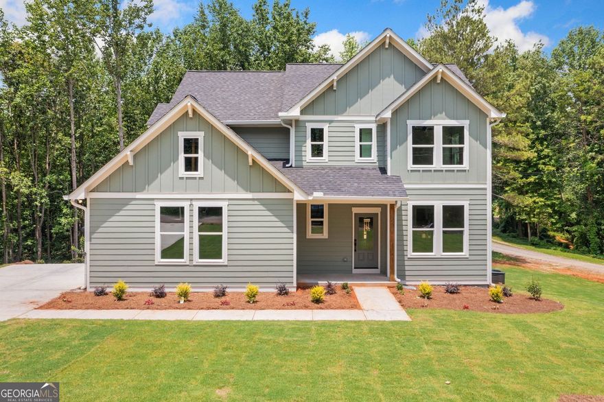 Welcome to your new home on over two acres of peaceful privacy in the scenic Salacoa area. This thoughtfully designed three-bedroom, two-and-a-half-bath home blends modern comfort with natural surroundings. The open concept layout is perfect for both daily living and entertaining, offering space and flow that feel just right.  As you enter, you'll notice the durable LVP flooring throughout the main level. It connects the bright and inviting living room with the stylish kitchen and dining area. Big windows bring in lots of natural light. The wide back deck is perfect for relaxing and has nice views of the woods. Stairs lead down to a roomy yard.  Upstairs, soft carpet adds warmth to the bedrooms. The generous primary suite includes a large walk-in closet and a tranquil en suite bath with a freestanding soaking tub and separate shower for the perfect retreat after a long day.  The side-entry garage provides easy access and great curb appeal. The walkout basement has amazing potential. Filled with natural light, this unfinished space is ready to be transformed to suit your lifestyle-whether that means a home office, gym, media room, or guest suite.  With no HOA, you have the freedom to enjoy your property your way. Surrounded by trees and tucked away on a quiet street, this home offers the privacy and flexibility you have been searching for. Experience comfortable living with room to grow in this beautiful new construction home.