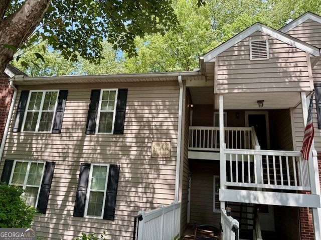 Located in a quiet subdivision inside Martins Landing community, this top floor unit has high vaulted ceilings, with 2 spacious bedrooms, 2 full bathrooms and Great room with Cozy Fireplace. While sitting on the back deck, relax and enjoy an awesome view into a wooded area with a creek, where you can listen to nature's sounds. laminate wood flooring, carpet in the bedrooms nice modern ceiling fans in the Master bedroom and Great room. Fabulous Amenity Package included Clubhouse, Lake, Pool, Tennis, Park, Excellent North Fulton Schools with easy access to shopping, restaurants, and GA 400. The Treasures are many in Martin's Landing. It is a neighborhood with green belts, numerous walking trails, wildlife and the beauty of nature surrounding it. Creeks and ponds run through the Landing, as well as the 53-acre Lake. A 2.4-mile walking path surrounds the lake, and on any given day, rain or shine, people are out on the path running, walking, or bicycling, meeting up with others who are strolling their babies, walking with their children, or watching the turtles, ducks and fish swim by A heron can often be seen. Seller will consider lease-purchase option.