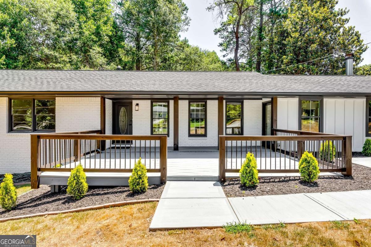 Welcome to a Fully Renovated 4-sided brick ranch-style home located in the highly desirable East Cobb area and a top-rated school district. This Modern / European style, bright and open floor plan features 4 bedrooms and 2 baths. Enjoy peace of mind with a new roof, new HVAC, and new windows, all enhancing comfort and energy efficiency. Step inside to find new flooring throughout, along with upgraded bathrooms featuring modern fixtures and finishes for a spa-like atmosphere. The remodeled kitchen boasts a large island, top-of-the-line appliances, and a thoughtfully designed layout that combines style and functionality. The kitchen opens to the family room with a fireplace and the dining room, creating a perfect space for entertaining and family gatherings. The renovated master bathroom features a standing shower with a frameless shower door, adding a touch of luxury. The finished basement includes a bedroom and living area, ideal for an office or movie theater room. Fresh exterior paint and a new driveway enhance the home's curb appeal, while a large new deck overlooks the expansive fenced-in backyard, perfect for outdoor relaxation and entertainment. Additionally, the property features an outside shed, providing extra storage space or a workshop area. The meticulously designed landscaping in both the front and back yards adds to the overall appeal, creating inviting outdoor spaces. New septic line from the house to septic, septic tank has been serviced in March 2025. With no HOA restrictions, this property offers you the freedom and flexibility to make it your own. Low Cobb county taxes! Close to everything Marietta has to offer. Don't miss out on this beautifully updated home in Marietta! Schedule a showing today. Qualifying buyers can benefit from 100% financing, several down payment assistance programs, for up to 5% DPA Funds when using our preferred lender. This is the turnkey home you've been waiting for-schedule your tour today! ***OpenHouse on Saturday, June 21st from 12 to 2 pm***