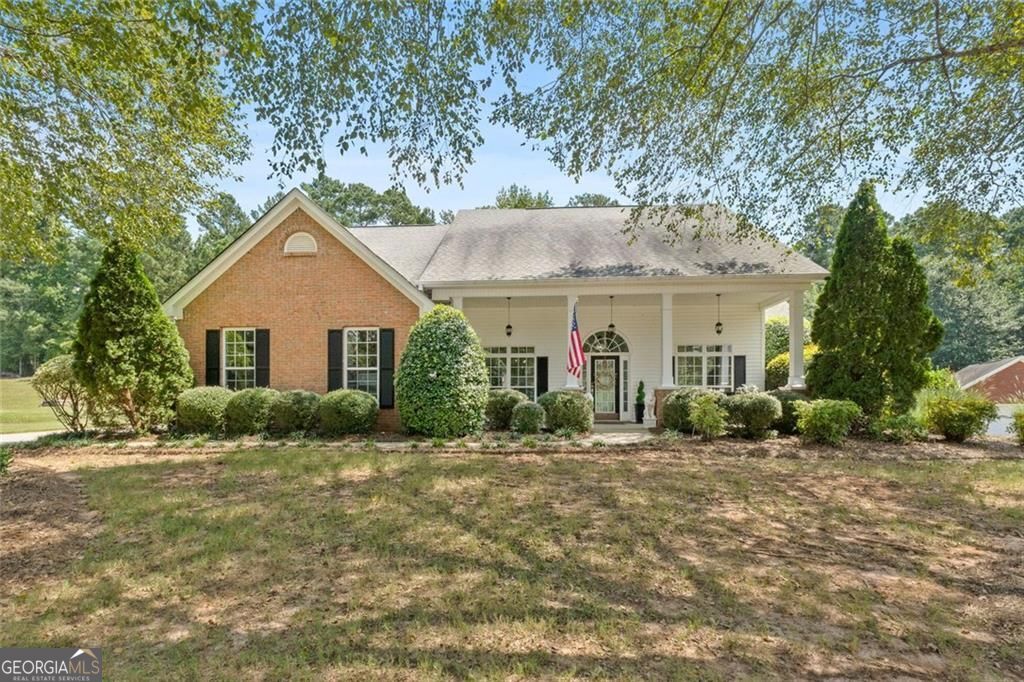 Beautifully well maintained cozy ranch in sought-after Ola school district with NO HOA! From the moment you step onto the oversized front porch, you'll fall in love with the peaceful setting, perfect for your morning coffee or tea. Inside, you're welcomed by a warm entryway, a formal dining room, and a versatile living room that makes a great office. You'll be dazzled by the unique and beautiful updated light fixtures and chandeliers showcased in every room. The family room offers a cozy gas fireplace and flows into the kitchen featuring a breakfast bar, stainless steel appliances, bay window breakfast nook, filtered water spigot, and upgraded cabinets with pull-out shelving for easy access to all your cookware. The spacious primary suite is a private retreat with walk-in closet, double vanities, and a jetted tub. Two secondary bedrooms are located on the opposite side for added privacy. Thoughtful upgrades include updated bathroom counters, skylight, built-in laundry cabinets (washer/dryer & refrigerator stay!), newer HVAC (approx. 1.5 years), built-in garage storage cabinets, leaf filter gutters, tinted windows, and a sprinkler system. Don't miss the walk-up attic space that can be finished for more living area or used as abundant storage. Nestled in a quiet, well-kept and peaceful subdivision, you'll love calling this home! Schedule your appointment today before it's gone tomorrow.