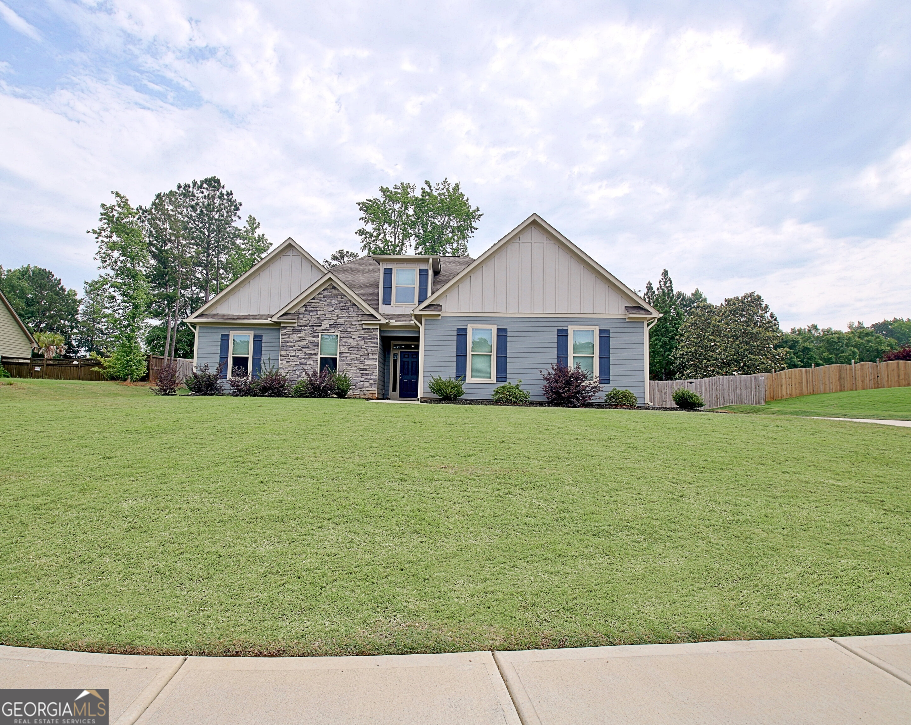 Beautiful home in Locust Grove sidewalk neighborhood with GOURMET KITCHEN! Large island, built-in DOUBLE OVENS and microwave, and countertops for days! You'll love the open floor plan and soaring ceilings in the fireside great room. **ENTIRE HOME has upgraded, wood plank, vinyl flooring.** Three bedrooms on main level including primary suite with spa bath - double, granite countertop vanities, a seamless-glass shower, separate bathtub, and a spacious WALK-IN CLOSET that conveniently connects to the laundry room! **Upstairs is a private, fourth bedroom with cozy sitting nook and another full bathroom. If you don't need a 4th bedroom, the space is ideal for a guest suite, office, or game room!** Covered back patio leads to LARGE BACKYARD is fully fenced! The two-car side-entry garage with epoxy floors is PERFECT!. NO HOA. Appointment required for showings and all Buyers must be pre-approved. Call your agent for an appointment to see this home! Come see this BEAUTIFUL HOME!