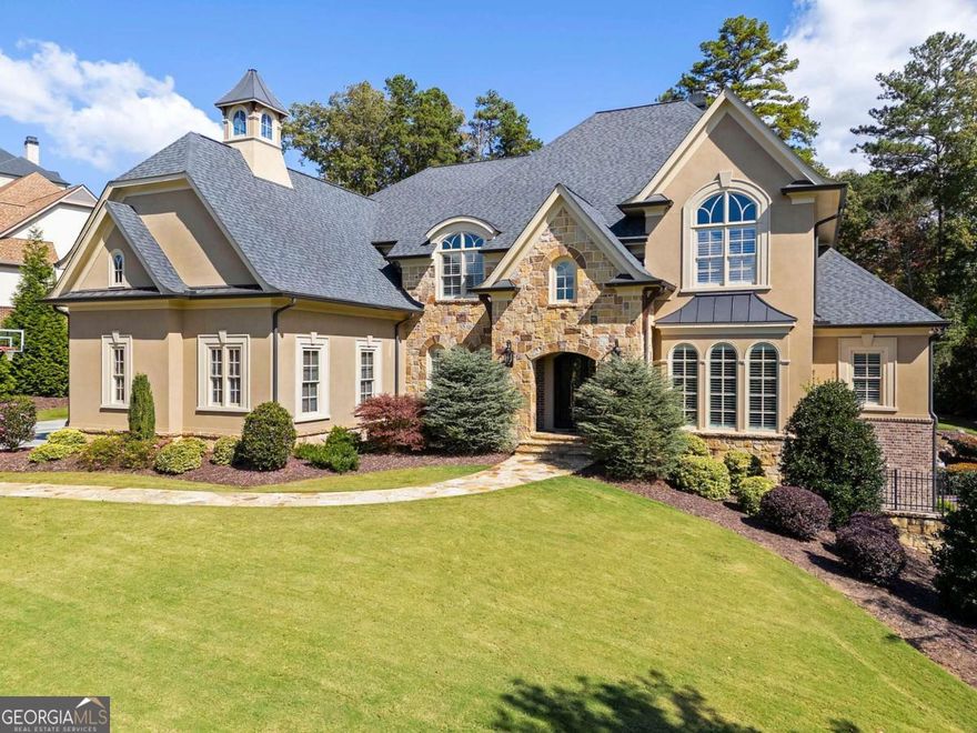 RECENTLY UPDATED & AGGRESSIVELY PRICED! Best value per square foot on the golf course in The Manor! Experience the PINNACLE OF LUXURY LIVING in this magnificent estate on OVER AN ACRE overlooking the 11th GREEN in the GATED COMMUNITY of The Manor Golf & Country Club. Offering OVER 10,000 SQ FT of refined living space with ONE OF THE FEW HOMES FEATURING AN ELEVATOR and HIGHEST-END FINISHES. Enjoy 5 OVERSIZED BEDROOMS (POTENTIAL FOR 6TH), including a PRIMARY SUITE ON MAIN and a SECONDARY MASTER SUITE ON UPPER LEVEL. Additional highlights include a STATE-OF-THE-ART GYM, MASSAGE ROOM, DEDICATED THEATER WITH DRY BAR, and STONE WINE CELLAR. The CHEF'S KITCHEN boasts SUBZERO & WOLF APPLIANCES, OVERSIZED ISLAND, and EXPANSIVE PANTRY. Features also include TWO LAUNDRY ROOMS, AN OVERSIZED DOG SPA WITH LARGE SHOWER, and a MUDROOM. Step outside to your PRIVATE BACKYARD OASIS with POOL, HOT TUB, OUTDOOR KITCHEN, PIZZA OVEN, FIRE PIT, COVERED PATIO WITH FIREPLACE, and BREATHTAKING GOLF COURSE VIEWS. Truly a MASTERPIECE OF ELEGANCE AND COMFORT!