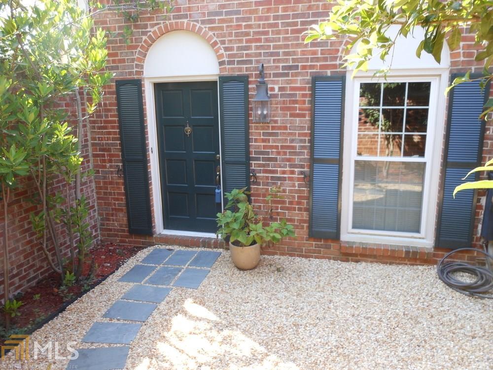 Fresh Paint & New Carpet! Spacious end unit 3 BD townhouse, eat-in kitchen, separate dining room, living room, powder room on main level! 3 BD & 2 BA upstairs. Finished terrace level w/laundry, bath and storage. Walk out from terrace level and main level. Conveniently located near I-285 and Perimeter. Parking for 2 vehicles only. Community pool. Floor plan is not an exact representation of this unit.