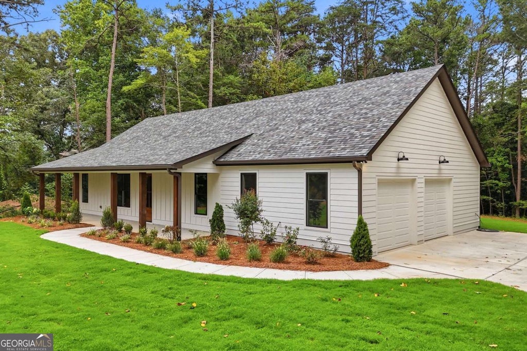 Photo of 647 S McCollum Drive, Canton, GA 30114 (MLS # 10816075)