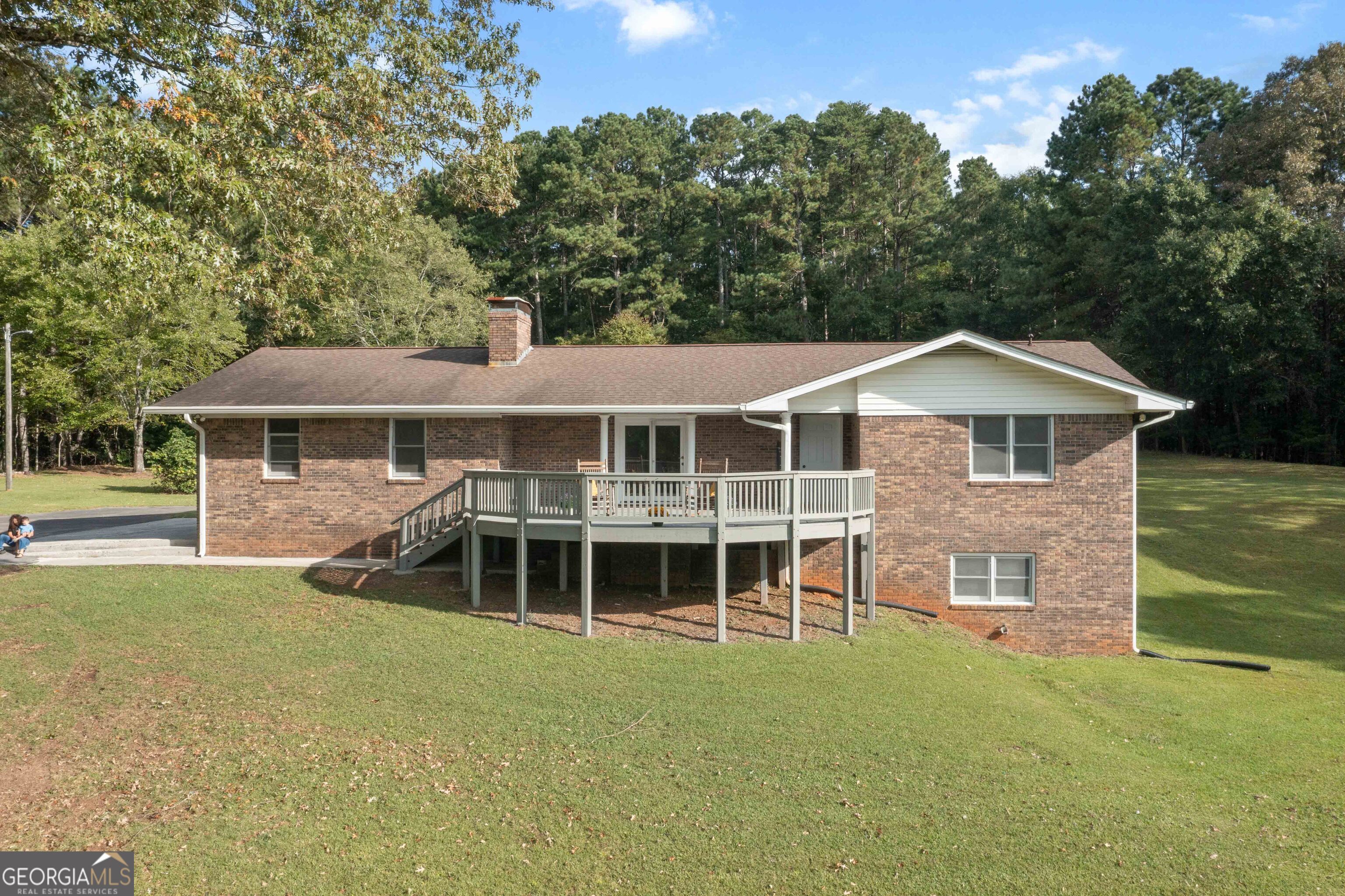 Your Dream Retreat Awaits - Brick Ranch on 24 Acres! Imagine waking up in a charming four-sided brick ranch surrounded by 24 acres of rolling woods and privacy. From the moment you pull up the paved driveway, you'll know this is more than just a home-it's a lifestyle. Step inside and enjoy fresh updates throughout: rich LVP flooring, modern lighting in every room, and a freshly painted interior that feels bright and inviting. The kitchen is both stylish and functional with hard surface counters and a gas stove, while the grand fireplace with gas logs makes the living area a cozy gathering spot. The primary suite is a true retreat with its handicap-accessible tiled walk-in shower as well as heated floors~ a thoughtful upgrade blending comfort and elegance. Love natural light? The sunroom is the perfect spot to sip morning coffee, read a book, or simply soak in the surrounding views year-round. But the magic doesn't stop upstairs. The full unfinished basement is already studded, plumbed, and wired-ready to become an in-law suite, rental, or ultimate entertainment space. With its own fireplace and private exterior entrance, the possibilities are endless. Outside, you'll love entertaining or relaxing on the front deck with mountain views or the back deck overlooking your wooded acreage. For the hobbyist or adventurer, the property includes a rustic barn housing the well pump with extra storage, an RV pole barn with additional parking, and an electric gate for added security. And with a whole-house generator, you'll always have peace of mind no matter the weather. When you're ready to explore beyond your land, you're just minutes from Rocky Mountain Recreation Area, offering hiking, fishing, and family fun. This is more than a home. It's privacy, potential, and pure beauty-all wrapped into one. Don't miss the chance to make it yours.