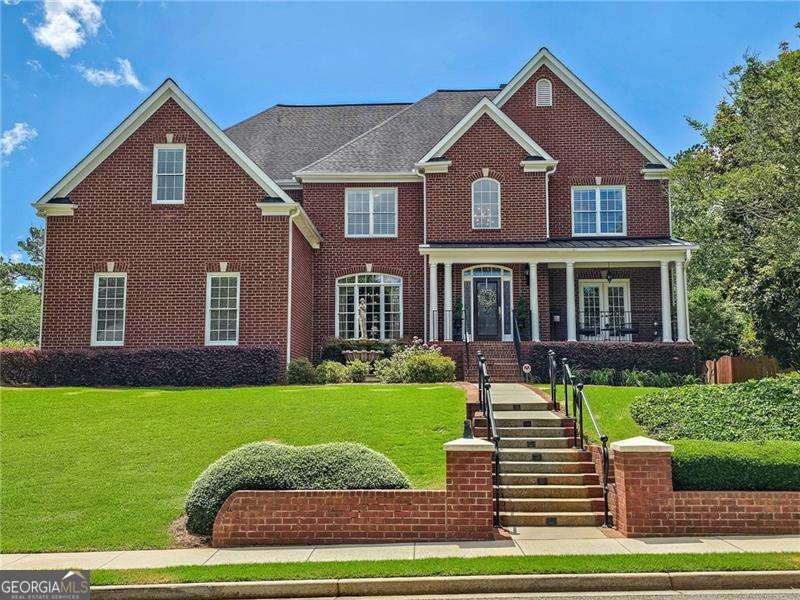 Welcome home to the quaint St. Michelle neighborhood in the Crabapple area of Alpharetta. This house has been beautifully maintained and is now available for rent. With its impressive five bedrooms and four and a half baths, this brick traditional home provides ample space with 3,972 square feet. Entering the front door, you will be greeted by a majestic two-story foyer which sits between the formal dining room and living room or study. Continue past the front staircase into a light-filled, two-story great room that opens up to the informal dinette area and kitchen, the perfect space for entertaining or just enjoying time with family. Additionally, the main floor boasts a guest bedroom with an ensuite bathroom, an additional half bathroom for guests, and a separate laundry room. Walk out to the private porch and backyard. Use one of two staircases to get up to the second level where you'll find four additional bedrooms and 3 more bathrooms. The oversized primary bedroom includes a sitting area, large closet, and large bathroom with double vanity, walk-in shower, and jacuzzi tub. Oak hardwood floors throughout the entire home. Attached 3-car garage. All appliances are included as well as the blinds and window treatments. Located in a top-rated school district. Walking distance to Crabapple restaurants and shopping, a short drive to everything Alpharetta has to offer. $5000/month rent includes weekly lawn maintenance. Home is not being offered furnished. The owner/landlord will be using the basement for storage.