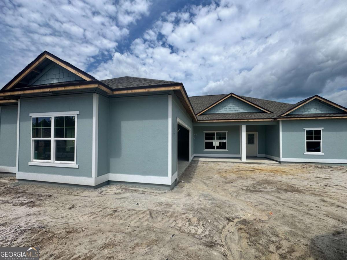 **Estimated completion scheduled for October 2025.** Welcome to your brand-new home by trusted local builder Josselyn Homes, nestled in the desirable Lake Victoria community! This 3 bedroom 2 bathroom home includes a flex space and an oversized 2 car courtyard garage! Ideally located just 3 miles from local schools, Laurel Island Links, and Chick-fil-A. With quick access to I-95, you'll enjoy an easy commute to Brunswick, Jacksonville, and Kings Bay. Step inside to find thoughtful upgrades throughout, including radiant barrier roof sheathing for extra efficiency, smooth walls with bullnose-corners, recessed lighting, and 9-foot ceilings. The kitchen is equipped with granite countertops, stainless steel appliances, and soft close cabinets. EVP flooring in the main living areas, with plush carpet in the bedrooms for added comfort. The spacious primary suite offers a true retreat with a double vanity, garden tub, separate tiled shower, and walk-in closet. Outside, take in peaceful pond views from your backyard, perfect for relaxing or entertaining. Don't miss your chance to own this thoughtfully designed, new construction home in one of Camden County's most convenient locations!** Builder holds a real estate license and related to listing agent/broker. **Interior Pictures from previously constructed property, finishes will vary!**