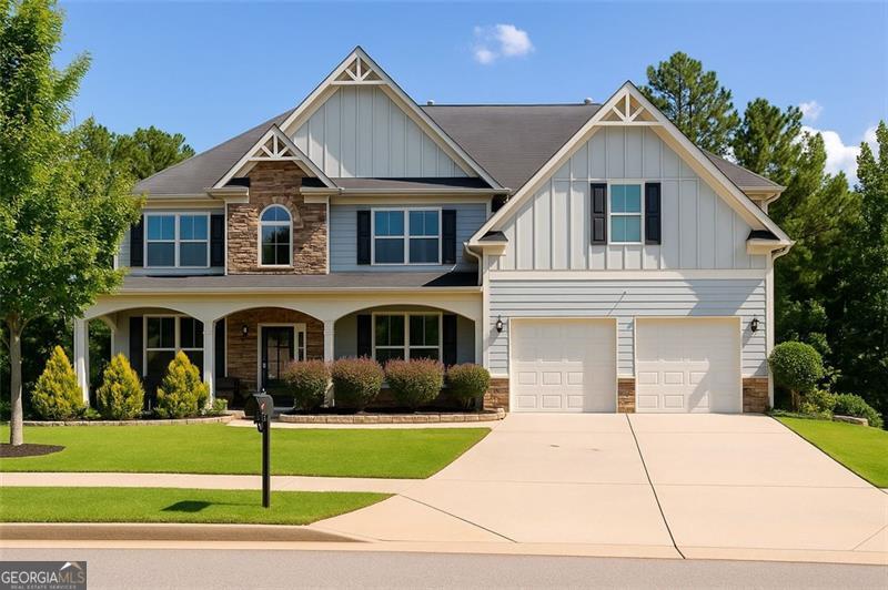 Hurry! This will not last long! Welcome to your dream home! Luxury Living with Room to Spare - 6BR/5BA with Finished Basement, Kitchen, Theater, Gym & More! Step inside to gleaming hardwood floors, soaring 2-story ceilings, and a dramatic catwalk that sets the tone for elegance. The gourmet chef's kitchen is a true centerpiece, featuring stainless steel appliances, a custom range hood, custom cabinets, granite countertops, oversized island, walk-in pantry, and ample prep space-perfect for cooking and entertaining. The main level also includes a spacious family room with a cozy fireplace and built-in bookcases, a formal dining room, multipurpose room, mudroom, laundry room, and a guest bedroom with full bath. Upstairs, retreat to a massive owner's suite with a luxurious en-suite bath and generous closet space. Three additional large secondary bedrooms and two full baths offer plenty of room for family or guests. Downstairs, the fully finished basement is a showstopper with a home theater with barn doors, gym, bedroom, full bath, living room, and mini kitchen-ideal for in-laws, guests, or rental potential. Enjoy the outdoors with a sitting porch, deck, and well-maintained landscaping, plus a convenient 2-car garage for extra storage. Don't miss this rare opportunity to own a spacious, high-end home with all the extras you've been dreaming of. Schedule your private tour today! Sellers are motivated