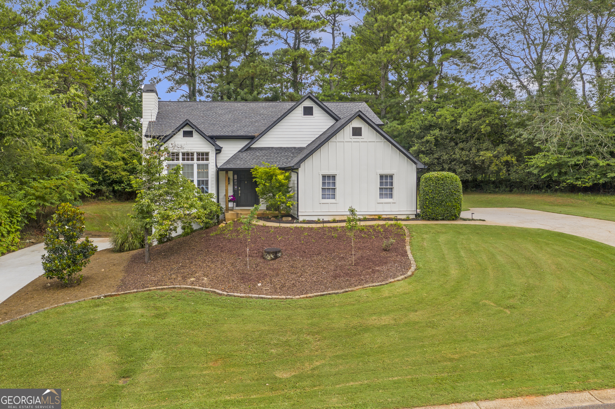 This charming home offers plenty of peaceful space next to open fields, just minutes from vibrant downtown Suwanee, Buford & Sugar Hill. Enjoy morning coffee on your private deck, cook in a gorgeous renovated kitchen, and imagine the possibilities in a full walkout basement with a separate driveway. Upgrades include HVAC replaced in 2023, siding/gutters in 2024, windows in 2019, roof in 2017, Trex deck in 2024, kitchen appliances in 2021, primary bathroom full remodel in Oct 2024, full guest bathroom in July 2025, Fence in 2024, and more! Seller is Agent