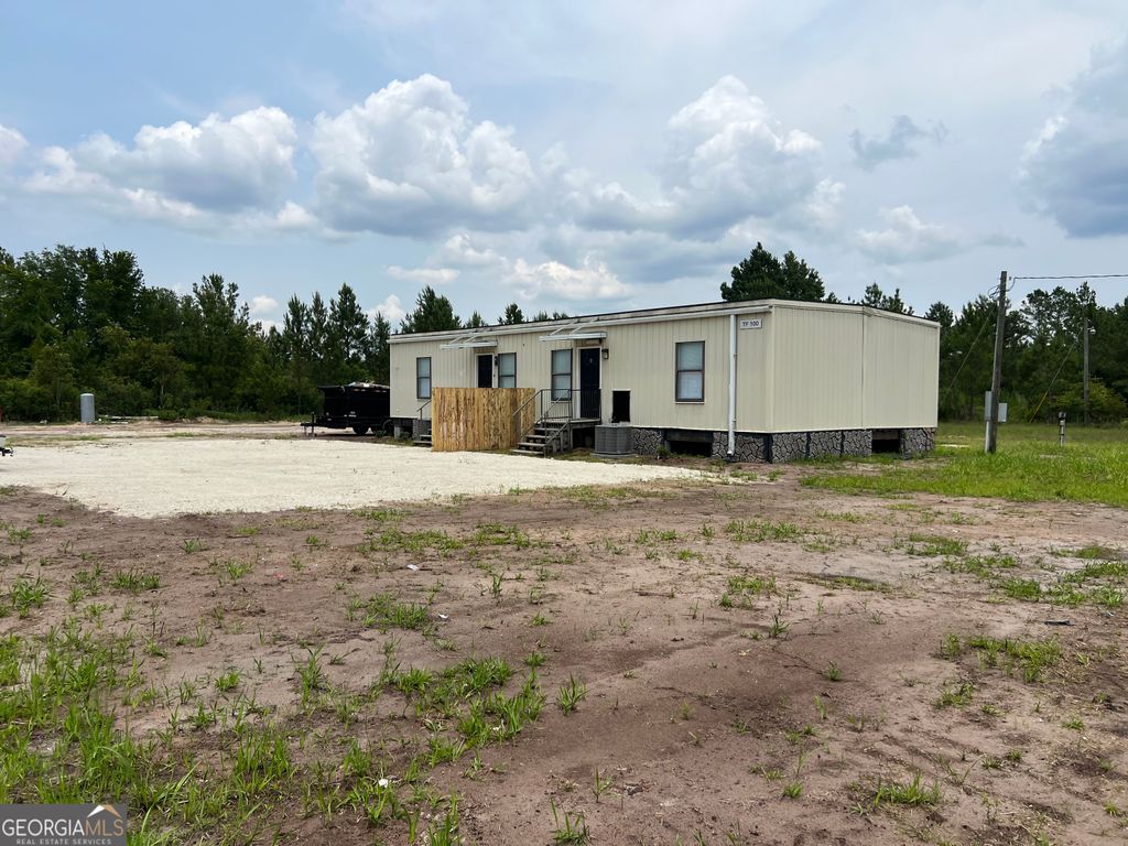 Photo of 124 NE Worthington Drive NE, Ludowici, GA 31316 (MLS # 10653371)