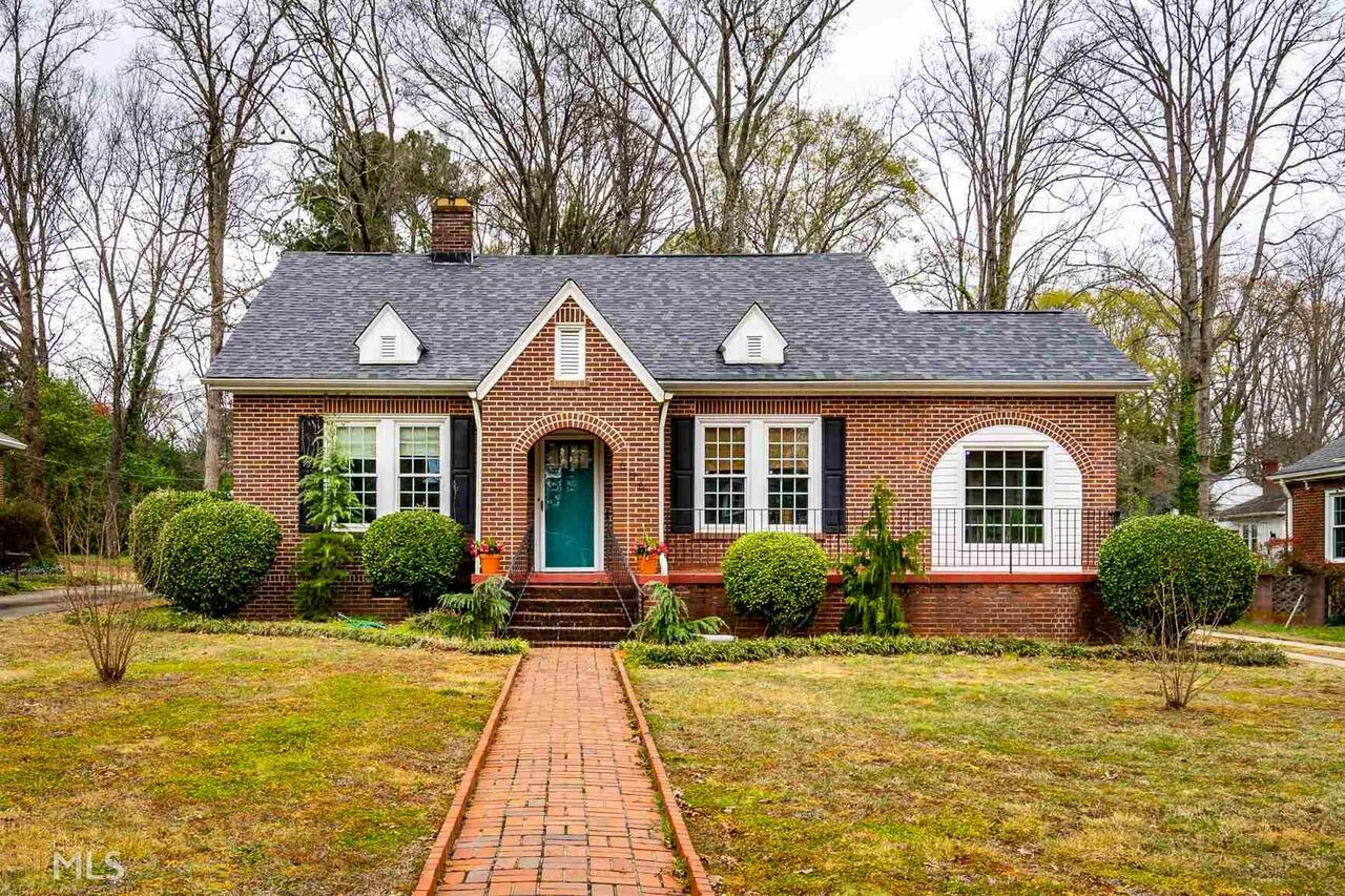 Located in the highly sought after area of North Anderson this historic home is a complete charmer. The brick sidewalk leads you from the street to the front porch with arched brick details and black iron railings. The original hardwood floors flow throughout the home, crystal door knobs throughout, and over 9 ft ceilings in every room. The fireplaces are no longer functioning but boast the original character of the 1930's. The butlers pantry is a great area to show off your china and stemware leaving room for a bigger table in the already large dining room. This home receives tons of natural light through the large windows and the sunroom is a great area for house plants. The kitchen features 42" cabinets, granite countertops, and stainless steel appliances. There are three large bedrooms with tons of storage and the master has a quaint half bath attached as well. The backyard is already setup with a perennial garden off the patio and a partially fenced yard. Don't miss your chance to own a piece of history!