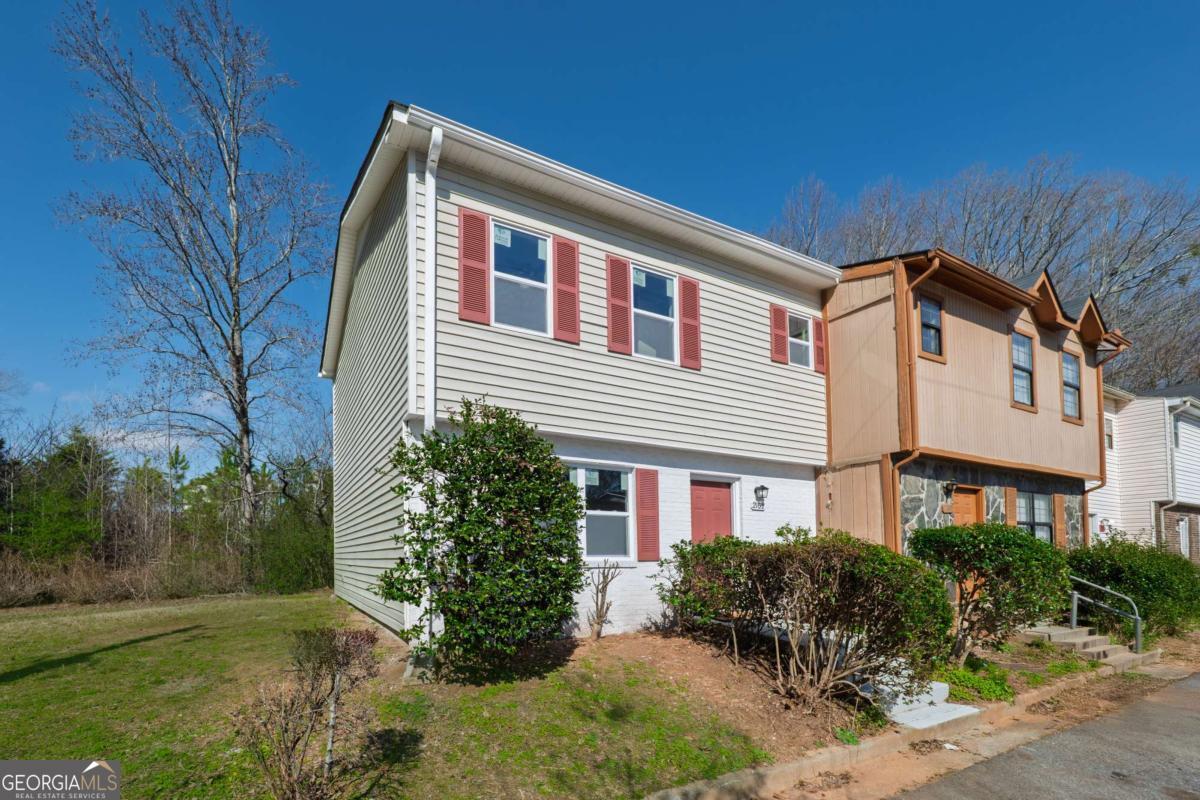 Welcome to 2102 Lenoa Lane, a completely renovated townhome in Austell, Georgia. This 2 bedroom/2.5 bathroom, renovated home combines elegance with everyday comfort, making it a standout choice for homeowners and investors alike. Inside, you'll find luxury vinyl plank flooring every where. All brand new double pane nigh efficiency vinyl windows. All newly installed light/fans in every room. The open-concept design creates the perfect space for entertaining. The kitchen features all brand new appliances and views to the dining and living areas. Both bedrooms' are located upstairs and the hall full bathroom complete the upper level, offering flexibility for guests or work-from-home needs. Only a few hundred yards from the entrance of the Siler Comet Trail. Located just minutes from Target, LA Fitness, Wellstar Cobb Medical Center, Lowes and the Austell International Farmer's Market, you'll enjoy easy access to shopping, dining, and entertainment via the East-West Connector. For investors, this property is a dream-it qualifies for long-term, short-term, and mid-term rentals, offering incredible flexibility and income potential. No HOA means you have the freedom and flexibility to maximize its potential.