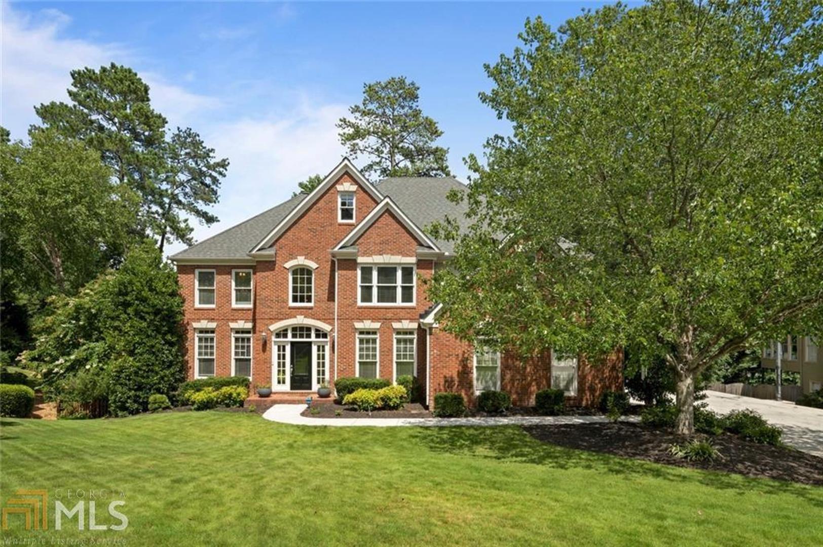 Indoor/outdoor living at its finest! Adults and kids alike will enjoy the putting green, built-in fire pit, hot tub, waterfall, multi-level decks, large play area and fenced in backyard. Lower patio with motorized retractable screens, under-decking and TV. Fabulous finished basement with theater, kitchen/bar, rec room and bonus room/full bath for guests! Main floor boasts high ceilings, light-filled rooms and bed/bath for guests preferring no stairs. Fresh paint, refinished hardwoods, new carpet. Nestled in sought-after Chickering. Just minutes to Historic Roswell.