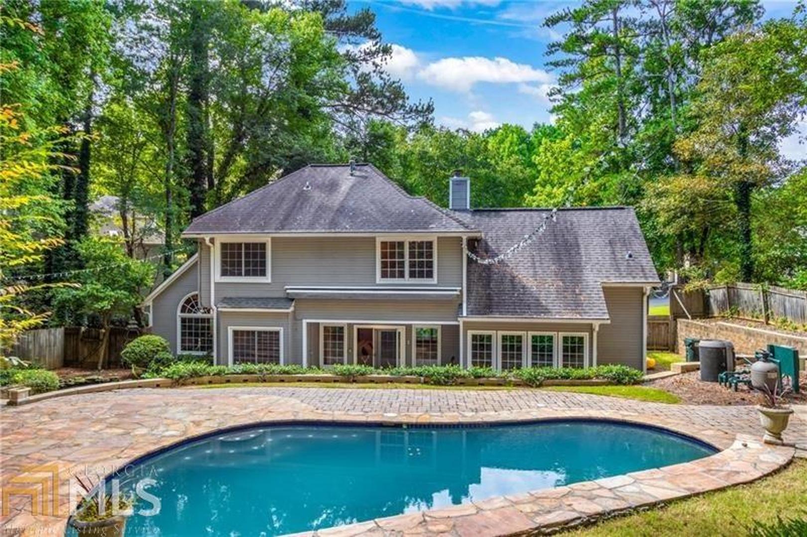 AMAZING HOME WITH HEATED POOL. 3 bedrooms BONUS ROOM & 2 1/2 bathrooms. Master on Main with renovated Master Bathroom. Excellent schools/ in Johns Creek. Walk in the front door to high ceilings and hardwood floors. Kitchen with granite counter tops, and one of a kind brick accent walls around cook top with double oven. Master closet has been professional design. Upstairs you will find 3 bedrooms with a large bonus room. After your tour of the house head towards the backyard, let down the mechanical awing to relax in your own resort. VACANT/ANY TIME ACCES