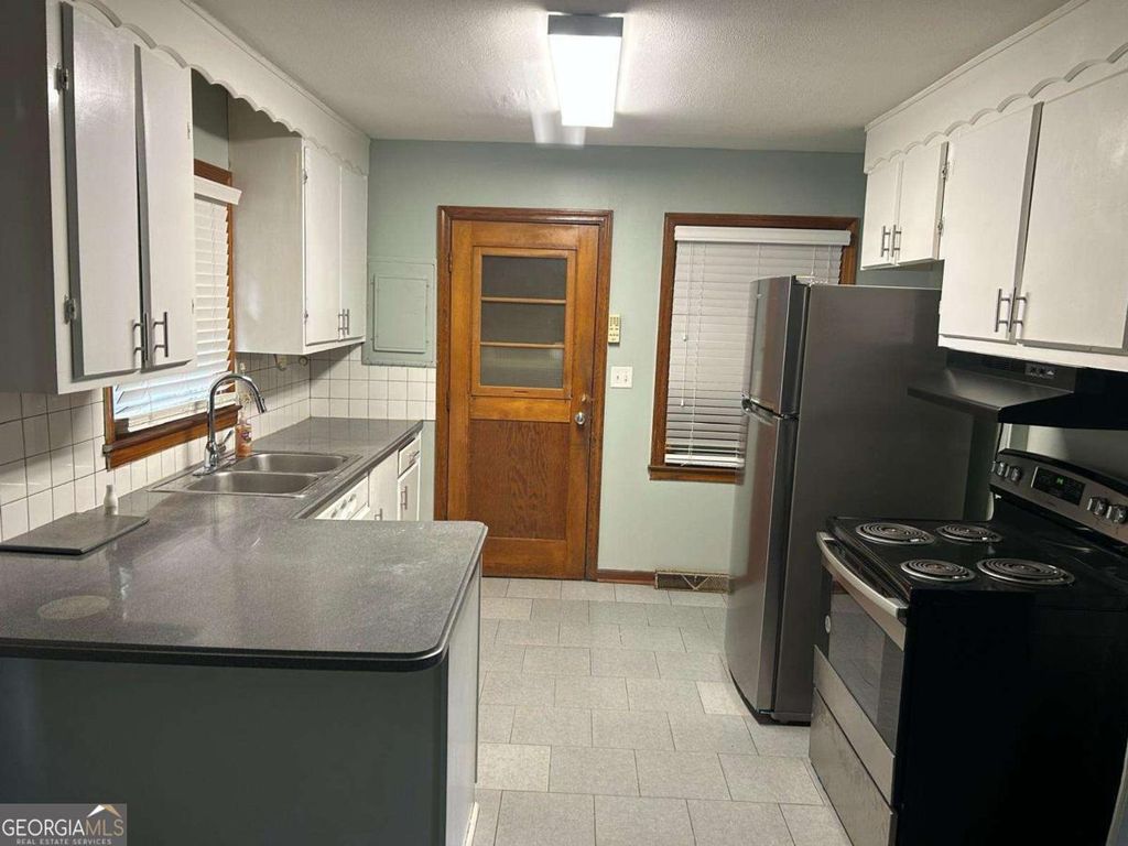 Photo of 106 Eleanor Cir, Atlanta, GA 31088 (MLS # 10693407)