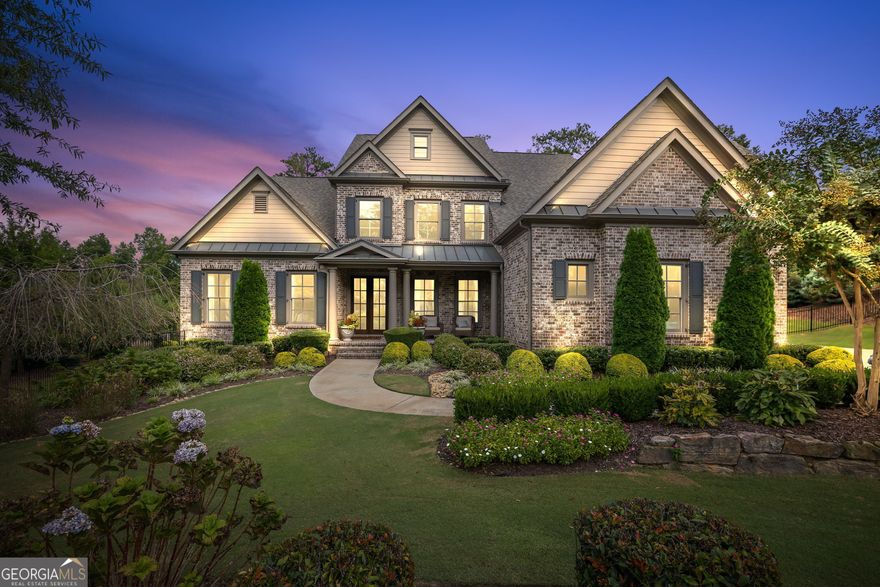 Timeless elegance meets resort-style living in this exquisite 4-sided brick estate, located on over an acre of professionally landscaped privacy in the exclusive Manor Golf & Country Club. Overlooking the picturesque 9th green, this custom 6-bedroom, 5.5-bath home built in 2019, offers 5,700+ finished square footage of thoughtfully designed space, with only one adjacent neighbor-privacy and serenity at its finest. A grand two-story foyer welcomes you with rich red oak hardwoods, soaring ceilings, and natural light that flows into expansive living spaces. The formal dining room and private office set the tone for refined elegance. The open-concept living room features rich wood coffered ceilings, built-in bookshelves and a cozy fireplace, all flowing seamlessly into the chef's kitchen-equipped with Wolf appliances, Sub-Zero refrigerator/freezer, a built-in coffee & espresso system and a generous island for entertaining.  Off the kitchen, a separate guest bedroom with its own en-suite bath provides a quiet, private space, - perfect for overnight guests or extended family. A spacious laundry/mudroom also off the kitchen, includes a custom pet washing station-designed with every detail in mind. The main-level primary suite is a true retreat, offering a tranquil sitting area, direct access to the covered porch, a spa-inspired bathroom with dual vanities, soaking tub and a large custom walk-in closet with built-ins. Upstairs, you'll find three spacious bedrooms-one with an en-suite bath-and an oversized entertainment loft perfect for a home theater, playroom or additional living space. The finished terrace level is an entertainer's dream, featuring a stunning wet bar with wine fridge and ice maker, pool table room, a fitness studio, flex bedroom and ample space for guests or multi-use living. Step outside into your private backyard resort-style oasis, framed by elegant wrought iron fencing and lush custom landscaping. Enjoy a heated Pebble Tec saltwater pool and spa, outdoor kitchen cabana with elegant wood ceilings, a built-in grill and stone masonry fireplace, Sunpak heaters and remote-controlled sunshades-ideal for year-round entertaining. Additional features include 3-car garage with 9-ft wide doors and epoxy floors, additional 1569 sq ft of unfinished space at terrace level and Smart home and irrigation system. As a resident of The Manor, enjoy access to a Tom Watson-designed golf course, indoor and outdoor tennis courts, resort-style pools, a world-class fitness center, clubhouse dining and an active social calendar. This is more than a home-it's a lifestyle of elegance, comfort, and unmatched community living.