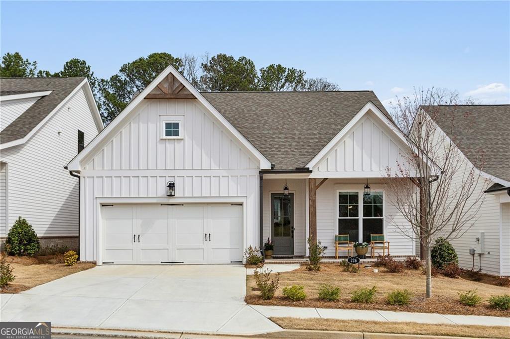 This absolutely charming, delightful, easy living home with a beautiful farmhouse exterior, including a covered front porch and foyer entry with 10' first floor ceilings. Enjoy a primary on the main that features a double vanity, large walk in shower and huge walk in closet. The chef's kitchen features beautiful design finishes, including white stacked cabinets that reach to the ceiling at the perimeter, an oversized island with quartz countertops, a white picket-style tile backsplash, and a single-bowl stainless sink. The open concept kitchen and living areas are perfect for entertaining while feeling cozy and inviting. The living room features a dramatic floor-to-ceiling vertical shiplap fireplace surround. The formal dining room seats twelve and features a convenient butler's pantry with a large, attached pantry. The upper floor features two secondary bedrooms, a shared bathroom, and a substantial loft that can serve as an office or media room. This home comes with over $10,000 in custom, high-efficiency Hunter Douglas sound and light-insulating blinds. So much natural light throughout this cozy and thoughtfully designed "Morgan" plan by TPG. Idylwilde residents enjoy a resort-style pool, clubhouse, pickleball courts, garden areas, sidewalks, and green spaces. Conveniently located to shopping and local restaurants.