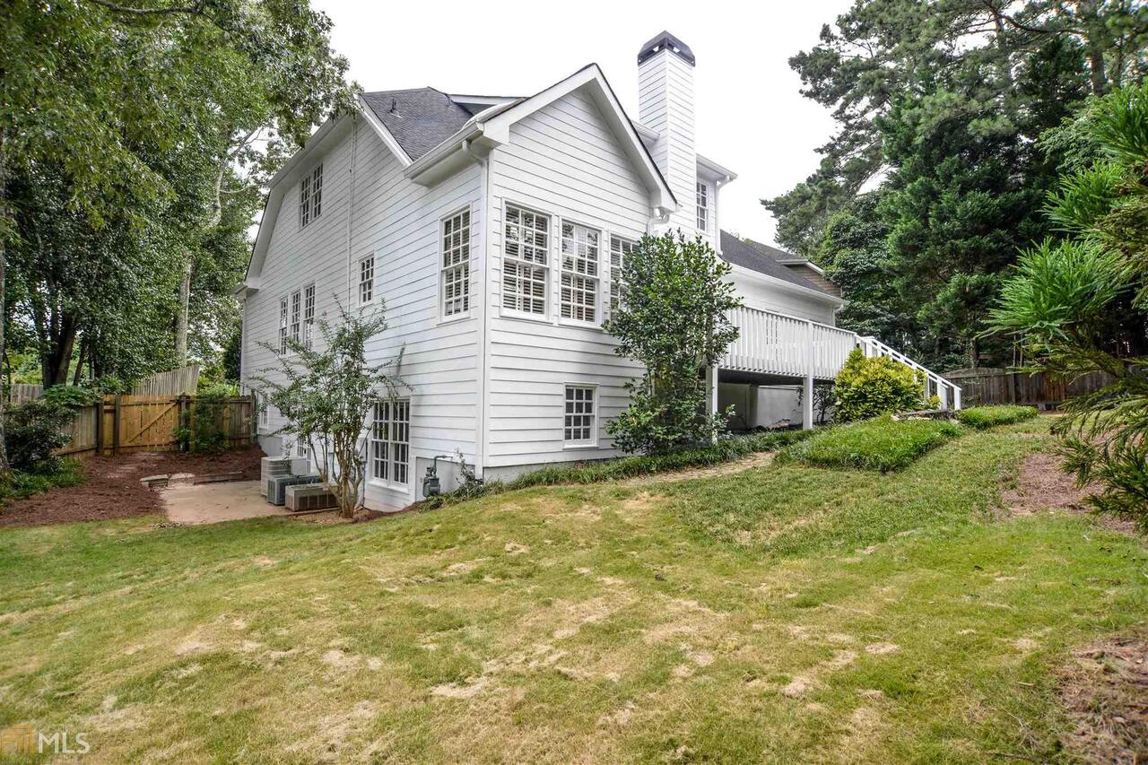 Beautiful home in one of Atlantas best school districts. In full in law apartment in the basement with a private access. The in law suite has 2 bedrooms a living room a workout room a workshop area and a kitchen and full bath with plenty of storage space. The house has been updated with granite counters and back splash and new appliances and lighting and new paint and carpet inside and out. The house is on a quite culdessac with a very level lot and a nice child and pet friendly back yard.