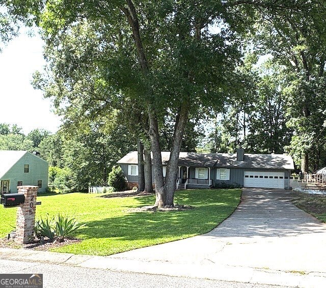 This three-bedroom, two-bathroom ranch-style home is situated on approximately half an acre. It boasts a spacious, modern open floor plan that is exempt from Homeowners Association (HOA) regulations. Additionally, it is conveniently located near dining establishments, shopping centers, and highly regarded educational institutions. The kitchen is modern and open, featuring a breakfast bar, white cabinets, and stainless steel appliances. It's a chef's dream! The great room, with its vaulted ceilings, features a cozy fireplace perfect for chilly evenings. The dining room with a French door leads to a level fenced backyard with a new, completely refurbished back deck, perfect for relaxation and outdoor activities. The primary suite is equipped with his-and-hers closets with an ensuite bathroom. Furthermore, there is a two-car garage with an exceptionally long driveway, ensuring ample parking space for guests. The interior home has been recently painted with designer colors, making it ready for immediate occupancy. Real estate in this area sells rapidly, so seize this opportunity to make this home yours.