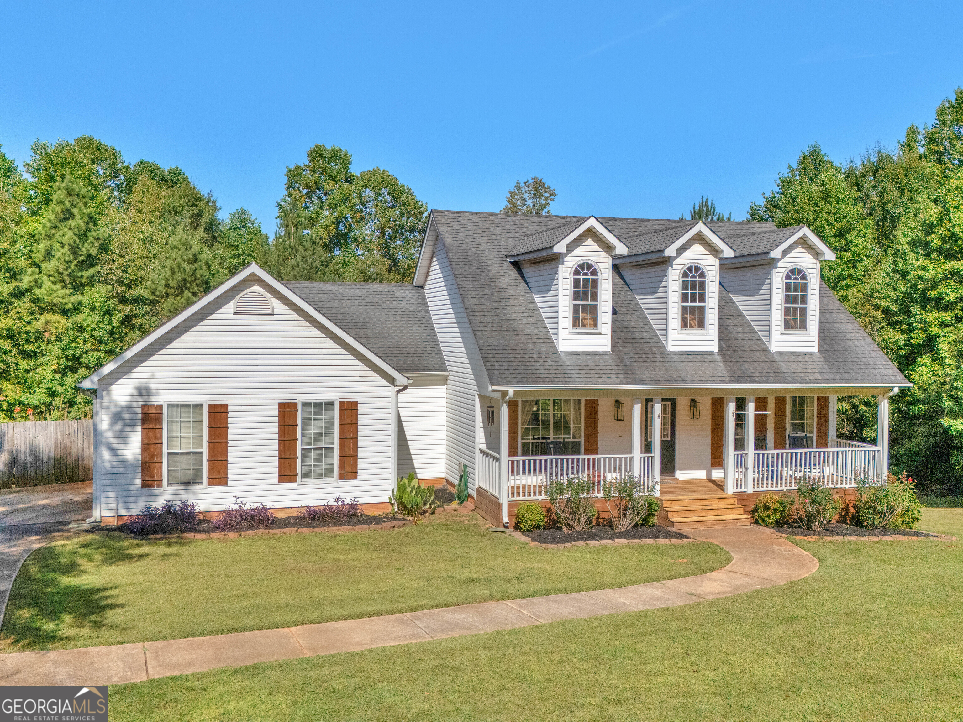 Stunning ranch home on 1.25 acres in the sought-after Ola School District-no subdivision! This 5-bedroom, 3-bath beauty offers the perfect blend of open-concept living and incredible outdoor entertaining space. The main level features 3 bedrooms and 2 full baths, including a spacious owner's suite with a vaulted ceiling, oversized walk-in closet, and a spa-like bath with a gorgeous tiled shower and glass enclosure. The open floorplan includes a vaulted family room with fireplace, elegant dining area, and a sunny breakfast nook. The kitchen is a chef's dream with abundant cabinetry, granite countertops, a large island with breakfast bar, and plenty of natural light. The fully finished basement expands your living options with 2 additional bedrooms, 1 full bath, a second kitchen area, media/second family room, and 2 bonus rooms-perfect for home office, fitness, or hobbies. Step outside to your own backyard oasis! A large covered back deck overlooks the sparkling inground pool with concrete surround, beautifully landscaped yard, and a covered patio with bar area-ideal for gatherings with family and friends. Enjoy privacy, space, and luxury all in one, just minutes from top-rated schools, shopping, and dining.